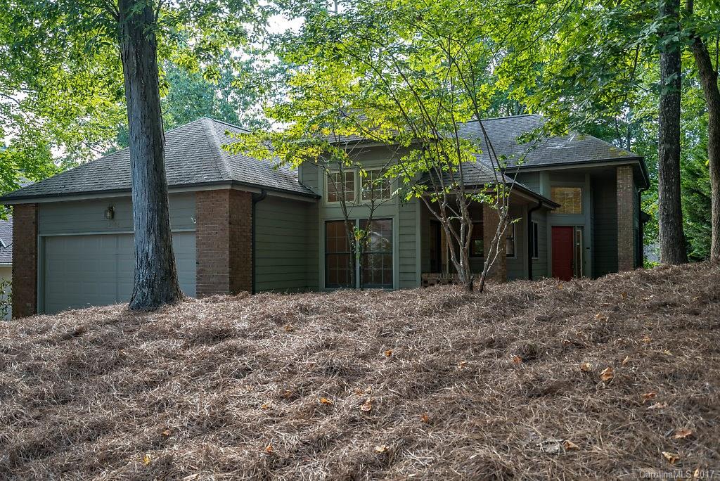 SELLERS ARE MOTIVATED!  Beautiful Ranch style home situated on a wooded lot in the Tega Cay Community. This home features, an open floor plan with a fireplace, new carpet, new paint throughout the home, granite counter-tops, 2 car garage, and an additional living space in the basement that could be used for a workshop and bonus area. Community offers walking trails, golf course, tennis courts, pool, playgrounds, and more.