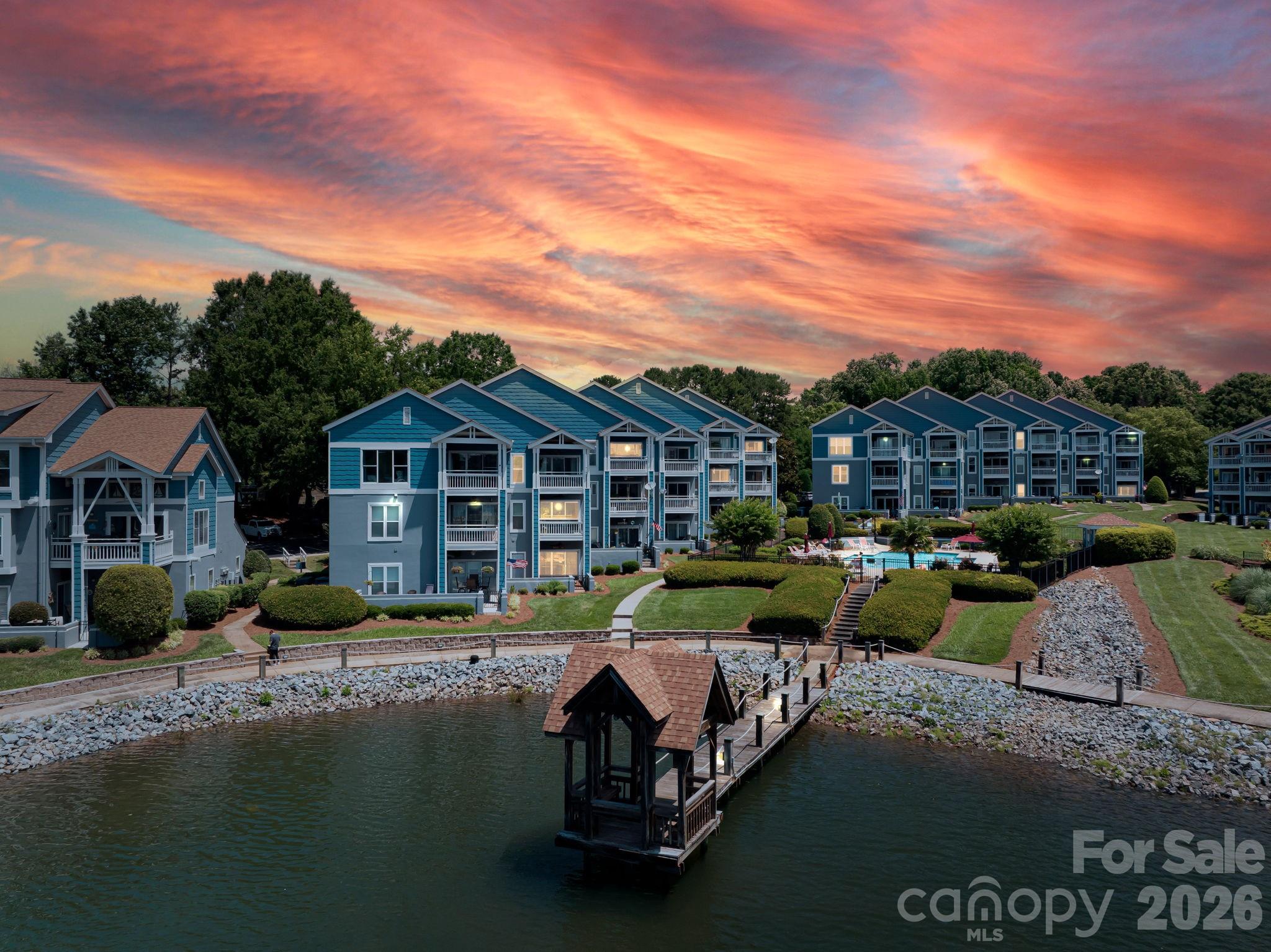 Ready for life on vacation in this Davidson waterfront penthouse?  There are so many updates to list in remarks...check out the special features list in the MLS.  This one doesn't just have expansive views of the lake, the pool, the pier but it also has the new infrastructure.   Furnace/heat pump dated 2023 and installed 2024.  Windows replaced in 2021.  Kitchen cabinets refinished and updated backsplash in 2023 along with a Bosch dishwasher and Samsung refrigerator in 2023.  Living area and second bath painted 5/25.  This one is move in ready...unpack and walk, roll, ride or drive to North Harbor Club or the Cottages across the way.  Less than 2 miles to downtown Davidson and all that it offers.  Easy access to 77.   What ever your activity...this community has it all...tennis, pickleball, pool, paddle, dog walking and much more. Sold furnished.  As of 3/5/2026 Lake Norman Company had 3 boat slips open exclusively for Davidson Landing Residents.  Call Chris at 704-892-4619.