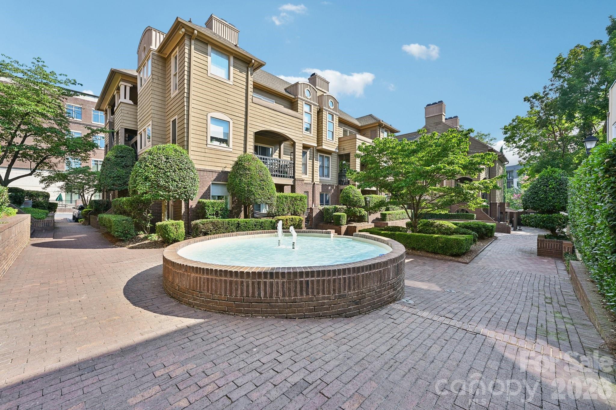 Walk out your door and into Dilworth. This renovated first-floor condo puts you steps from
East Boulevard’s best restaurants, coffee shops, and nightlife — and minutes from Uptown,
Carolinas Medical Center, and the Dowd YMCA.

Inside, the updates are real: fresh LVP flooring throughout, updated primary bathroom, fresh
paint, and a wood-burning fireplace that anchors a welcoming living room. Out back, your
private terrace is the kind of outdoor space people pay a premium for in Dilworth. The
community pool rounds out a lifestyle most people are still renting for.

New roof to be installed this summer - seller has paid that assessment so your buyer will have a brand new roof soon without worry of cost.

Two assigned parking spaces. In-unit laundry hookup / washer & dryer to convey to new owner. The HOA covers exterior maintenance,
landscaping, pool, and common areas — so your weekends stay yours. Move-in ready in Dilworth + $5,000 credit towards buyer expenses!