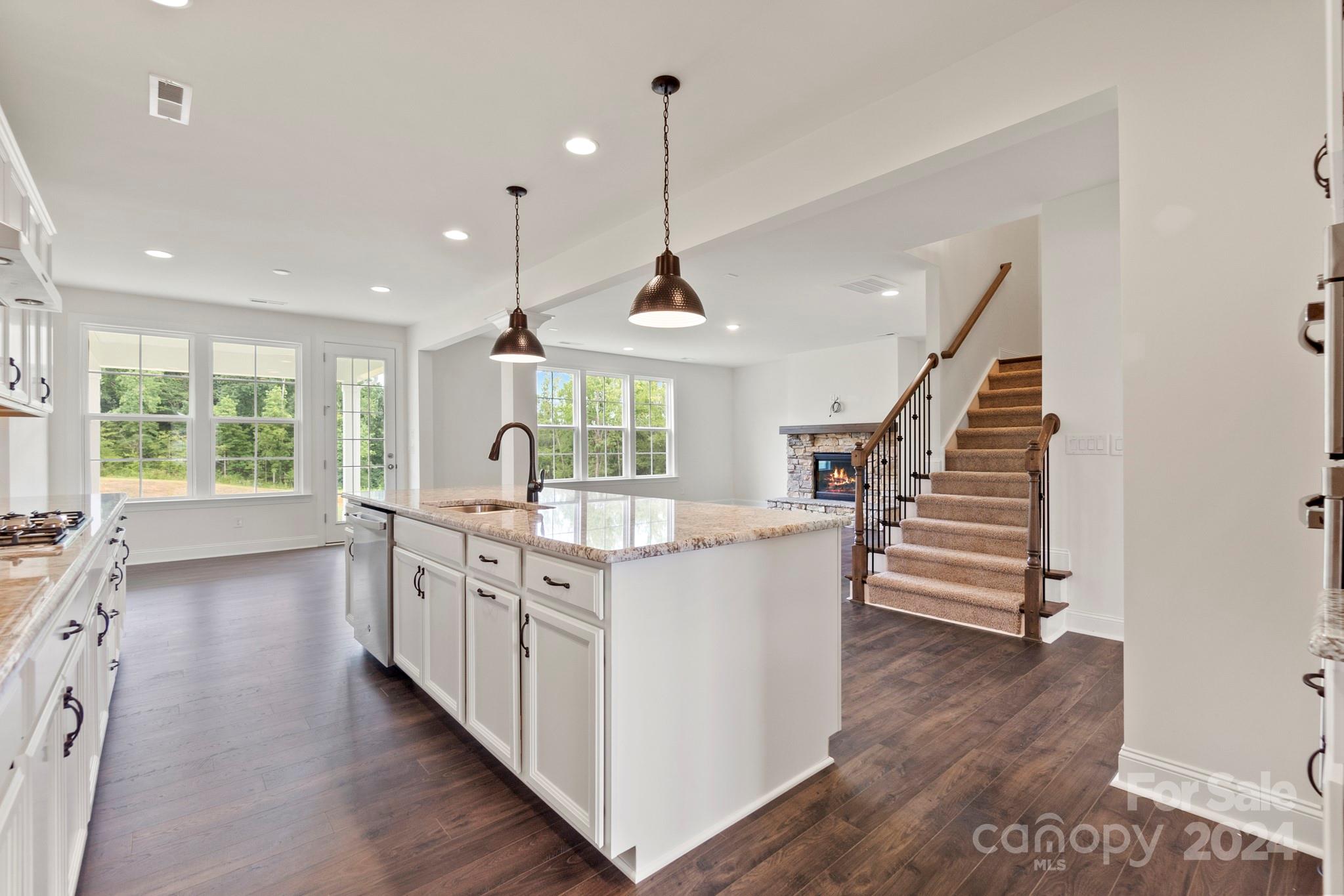 REPRESENTATIVE PHOTOS ADDED. June Completion! The Kenilworth plan spans two stories, featuring an open-concept first floor that encompasses a spacious gathering room and a gourmet kitchen. The entrance of the home boasts a first-floor study and dining room, while a welcoming guest suite is situated at the rear. Ascending to the second floor, you'll discover the exceptional owner’s retreat. Unwind in the luxurious owner’s suite, which includes a soaking tub, dedicated shower, dual sinks, and a spacious walk-in closet. Additionally, there are three bedrooms, two full baths, a laundry room, and a game room on this level. Outdoor living is enhanced by a covered porch. Structural options added include: tray ceilings at dining and owner’s suite, bay window at 2nd suite, study in place of flex, covered outdoor living, windows at 2nd bath, 2nd suite, and study, fireplace metal roof at designated areas, shower ledge at owner’s shower, tankless gas water heater.