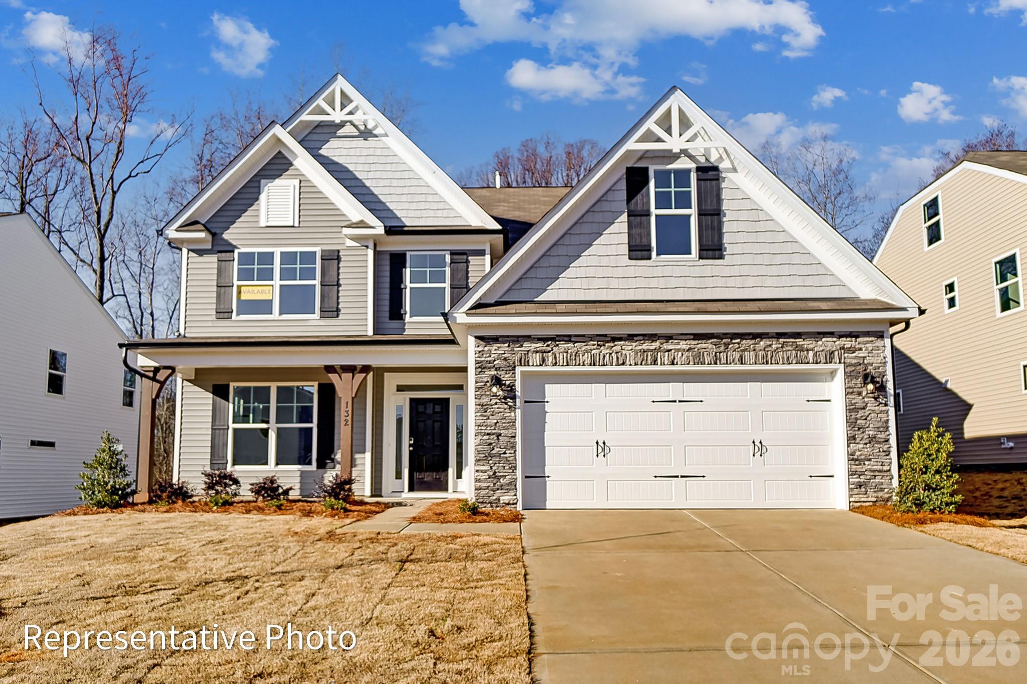Step into this marvelous McDowell plan in the highly sought after Rone Creek community of Waxhaw! This floorplan offers 4 bedrooms, 3.5 baths, and more than 3,400 square feet of living space. The primary suite is on the main and features a tray ceiling, large walk-in closet, and a tiled, luxury shower with bench seat and semi-frameless door. The 2-story great room has a direct-vent, Cosmo fireplace with a shiplap accent wall. The designer kitchen has white cabinets with a contrasting Evergreen island, quartz counters, tile backsplash, a shiplap range hood, and stainless appliances, including a gas cooktop. Cabinets extend into the breakfast area to create a perfect entertaining buffet. The butler pantry with built-in wine refrigerator connects to the dining room with tray ceiling. The main floor is completed with a laundry room with cabinets & sink, mud room with built-in drop zone, foyer with tray ceiling, and a half bath. The upper floor has 9-foot ceilings and has a bedroom with ensuite bath, two bedrooms that share a Jack-n-Jill bath, and a loft with a large, unfinished storage closet. Visit today and find out more!