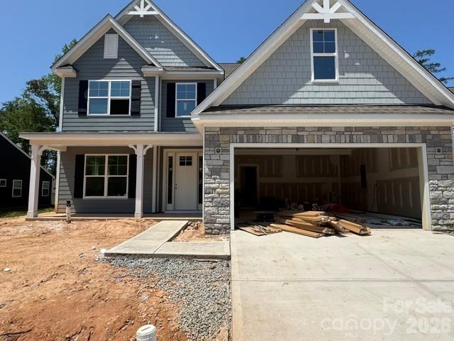 Step into this marvelous McDowell plan in the highly sought after Rone Creek community of Waxhaw! This floorplan offers 4 bedrooms, 3.5 baths, and more than 3,400 square feet of living space. The primary suite is on the main and features a tray ceiling, large walk-in closet, and a tiled, luxury shower with bench seat and semi-frameless door. The 2-story great room has a direct-vent, Cosmo fireplace with a shiplap accent wall. The designer kitchen has white cabinets with a contrasting Evergreen island, quartz counters, tile backsplash, a shiplap range hood, and stainless appliances, including a gas cooktop. Cabinets extend into the breakfast area to create a perfect entertaining buffet. The butler pantry with built-in wine refrigerator connects to the dining room with tray ceiling. The main floor is completed with a laundry room with cabinets & sink, mud room with built-in drop zone, foyer with tray ceiling, and a half bath. The upper floor has 9-foot ceilings and has a bedroom with ensuite bath, two bedrooms that share a Jack-n-Jill bath, and a loft with a large, unfinished storage closet. Visit today and find out more!