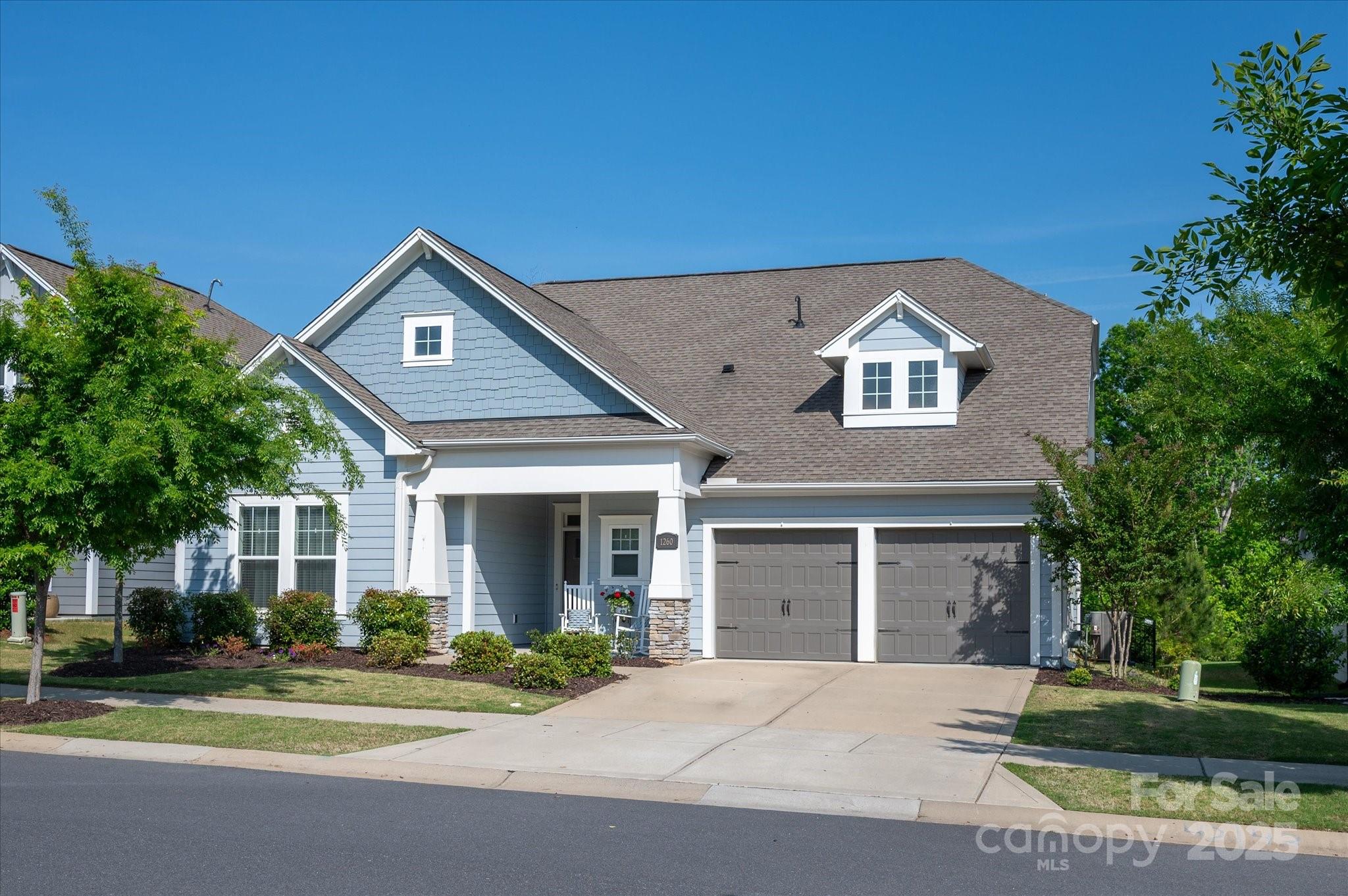 Don't skip this one! Fabulous home located in the popular Massey community with resort-style amenities. Built by David Weekly homes, this thoughtfully designed floorplan has the primary bedroom suite on main level with an additional bedroom + full bath—ideal for guests. Work from home in your private office space, while the open-concept living areas make this home function well for everyday living & entertaining.  Upstairs, you’ll find a loft + bonus room, 2 bedrooms & 1.5 baths.  Custom covered porch with stone fireplace & mounted TV, & expanded patio with summer kitchen enhance your outdoor living space. Fenced yard, with a year around wooded view & great privacy. Enjoy open common area across street, perfect for play or practice and community playground a short walk away. Home is beautifully finished throughout. Close proximity to neighborhood schools, quick access to I77, and ~10 minute drive to the new Target & Costco opening later this year! You’re going to love this home!