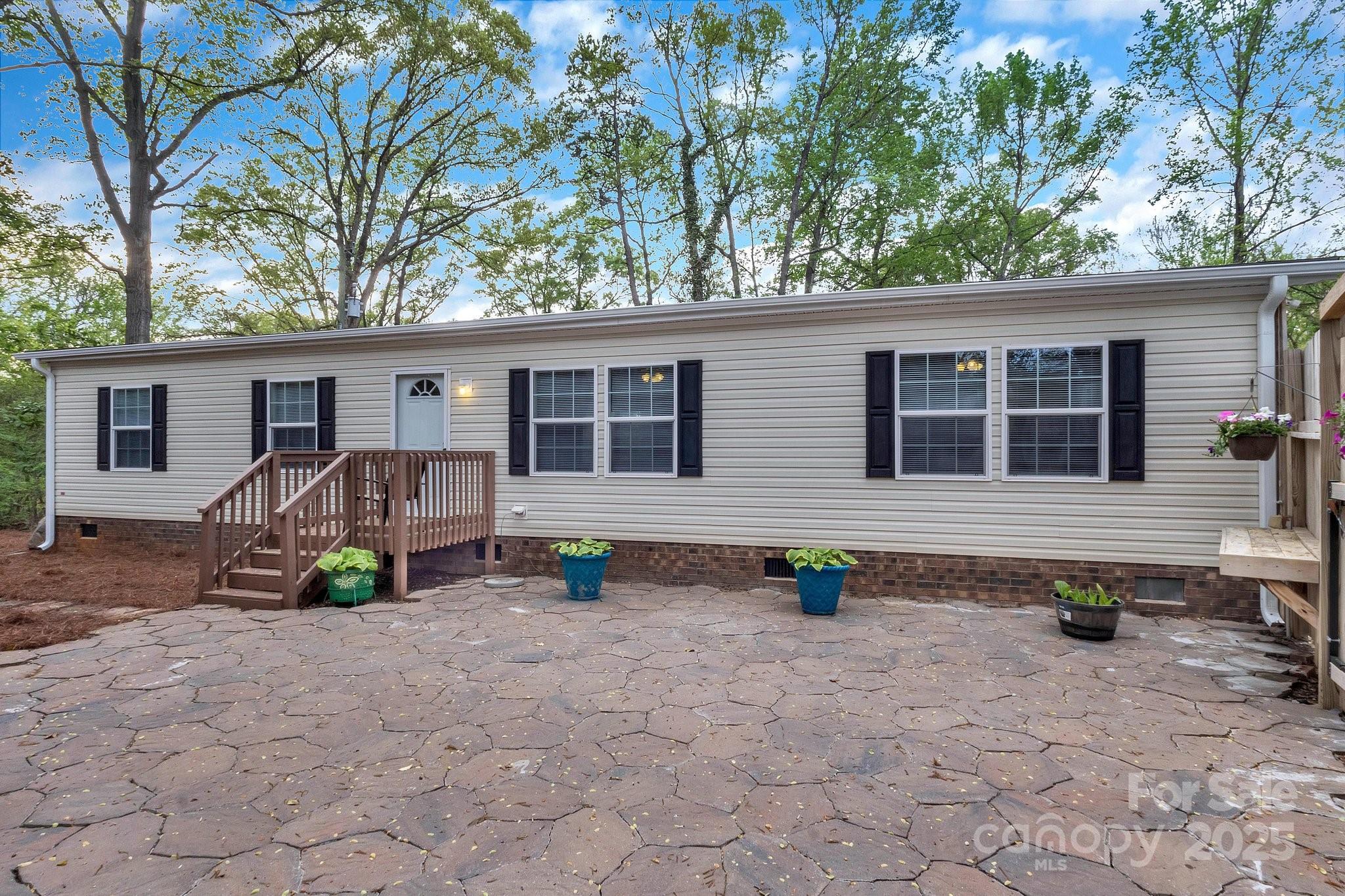 Are you looking for convenience and serenity all in the same place? Well, you found it! This home sits on a very private lot surrounded by mature trees. The home has brand new flooring, new roof, and the HVAC is 2 years old. It is MOVE-IN ready! The fenced in front yard allows for wonderful evenings of grilling, entertaining,  or just sitting and enjoying your solitude. The home is priced to sell. Come take a look and make an offer! There is not much in Fort Mill at this price with this much to offer!