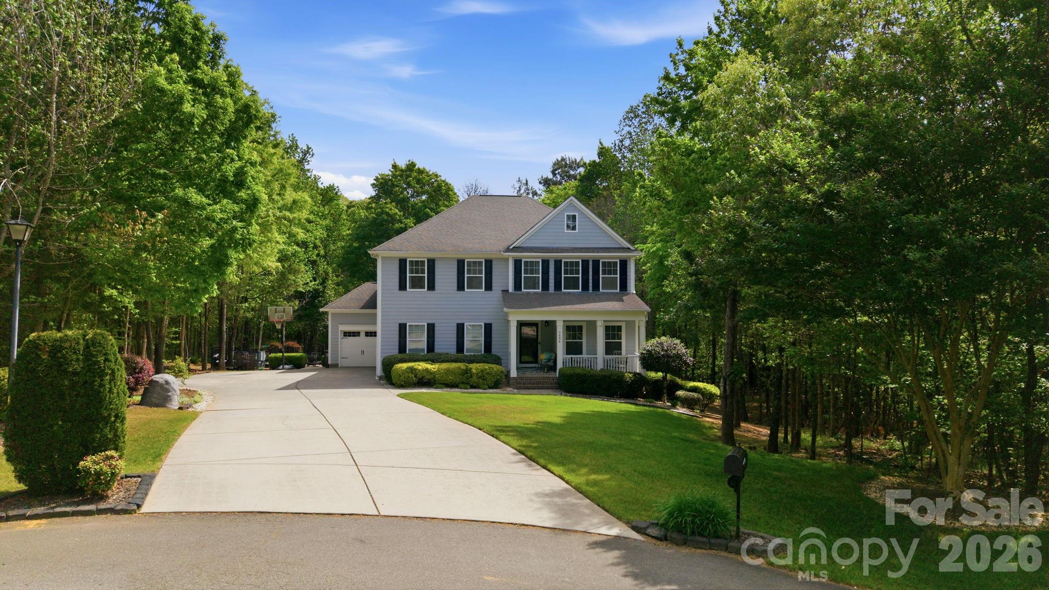 Welcome to 5404 Cotton Top Court, where peaceful country living meets exceptional space, flexibility, and comfort. Situated on 1.569 acres in the sought-after Waxhaw countryside, this recently appraised residence offers an opportunity to enjoy a property designed for the way people live today. Priced below its recent appraised value, this home presents a unique opportunity for instant equity while delivering luxury, space, and versatility.

A long private drive and three-car garage create an impressive arrival experience, while the thoughtfully designed interior provides room for everyday living, entertaining, and hosting guests. The formal dining room is ready for memorable gatherings, and the private main-level office with a full bath offers flexibility for a variety of lifestyle needs.

At the center of the home, expansive living spaces connect seamlessly, creating an inviting environment for both large celebrations and quiet evenings at home. Natural flow leads outdoors to a backyard retreat featuring a recently relined pool and rebuilt deck, offering the perfect setting for summer afternoons, weekend cookouts, or relaxing under the Carolina sky.

Upstairs, spacious bedrooms and a versatile loft provide additional room to spread out, work, play, or unwind. The fully finished lower level offers a private apartment-style living area that creates opportunities for extended guest stays, income-producing potential, additional flexible recreational living space, or extended living.

Designed with both comfort and practicality in mind, the property also features dual septic systems, a private well with a water softener, a new outdoor condenser installed in 2026, and newer basement carpeting.

Offering approximately 5,495 square feet across three levels, this home delivers the rare combination of privacy, versatility, and everyday convenience. Whether you're seeking room to grow, space to entertain, or a peaceful retreat from the pace of city life, 5404 Cotton Top Court provides a setting where lasting memories are ready to be made—all while benefiting from the confidence of purchasing below appraised value.