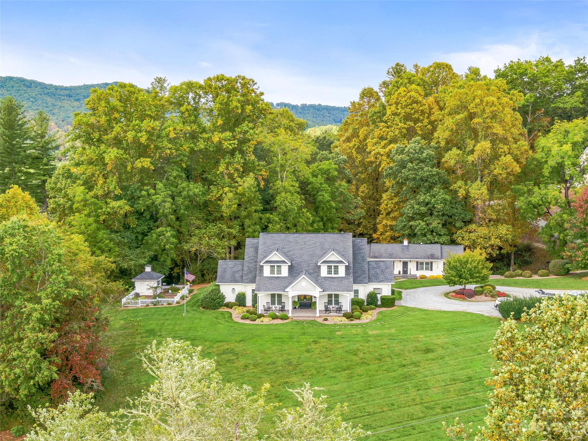 This remarkable property is located in Mills River, NC, and presents an incredible opportunity for a corporate retreat, family compound, or short-term rental investment. Situated on a  5-acre lot, the main house features five spacious ensuites, offering both privacy and luxury for guests. Additionally, the carriage house includes two ensuites and a caretaker apartment. The location is a testament to natural beauty and tranquility, providing a serene escape from the fast-paced urban life yet convenient to everything. Sold Fully Furnished; this turnkey feature not only simplifies your investment but the moment you take ownership, you can seamlessly start using it. The combination of ample space, well-appointed ensuites, and the caretaker apartment guarantees both comfort and convenience for all occupants.  Received Southern Living’s “#1 B&B Inn'' ranking in Southern Living’s “Best of the South Awards.” Located between Brevard & Hendersonville -minutes away from the AVL airport