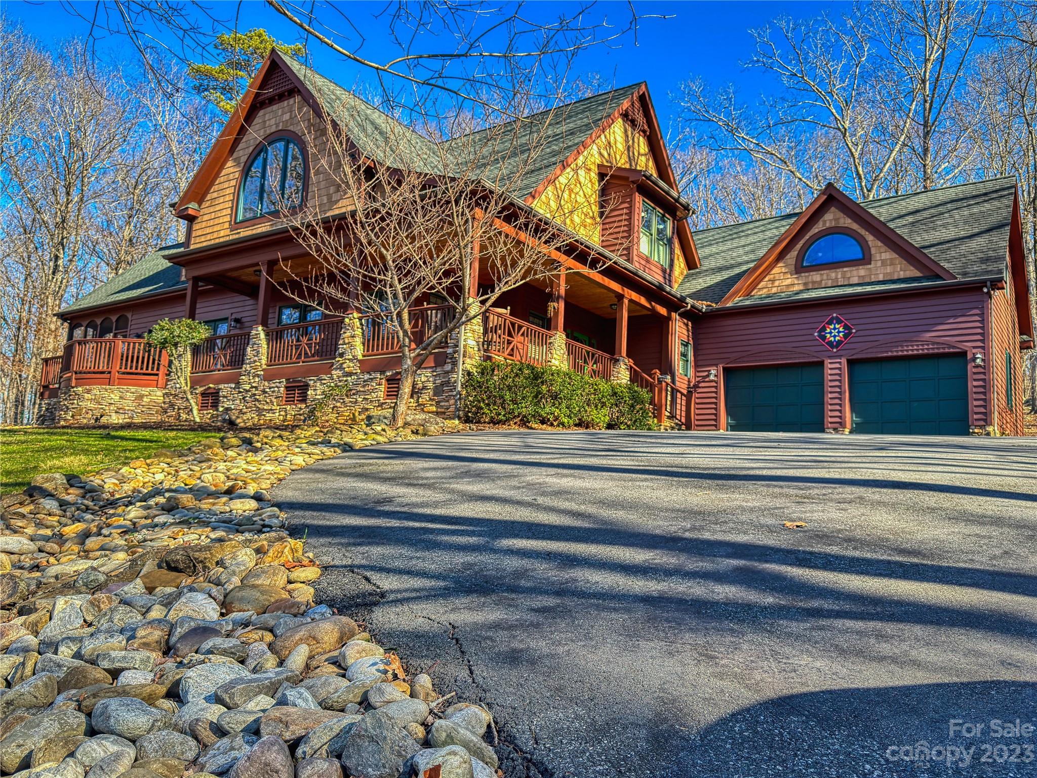 Welcome to 1515 Rocky Cove Lane, a distinguished custom-built mountainside retreat with a single owner, featuring 4 bedrooms and 3 full baths. This residence is designed for both expansive living and gracious entertaining. The main level showcases a spacious kitchen equipped with double ovens and a breakfast area, a living room adorned with a stone fireplace, and a dining room with convenient walk-out access to the backyard. Take respite on the screened-in porch or beside one of the two fireplaces. Ascending to the second level reveals the owner's suite, complete with his and hers closets and a breathtaking seasonal view of High Rock Lake. The primary bath boasts dual vanities, a jetted tub, and a walk-in shower. Continuing down the hall, two additional bedrooms are accompanied by a full bath, while a generously sized 38*19 finished room over the garage awaits with limitless potential .Refrigerator and Breakfast table will remain with the home, as it was custom built for the space.