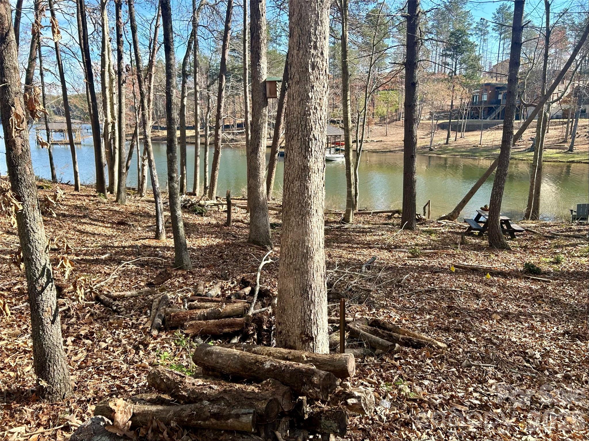 What if your mornings started with coffee overlooking the water and your evenings ended with the quiet glow of sunset across the lake? This 1.2-acre true lakefront homesite on Lake Rhodhiss offers 134 feet of shoreline and direct water access, creating the perfect setting for a retirement retreat, second home, or custom lake escape just outside Charlotte.

A dock permit has already been approved, making it easy to build your private dock for boating, kayaking, fishing, or simply relaxing right on the water.

The property is already partially prepared with a concrete driveway installed from the paved road, and much of the underbrush has been cleared, giving you a head start on building while still preserving the natural beauty and privacy of the land.

Located in the desirable Lakeside Reserve community, residents enjoy amenities designed for easy lake living including a community pool, pavilion, pickleball courts, walking trails, secure boat and RV storage, and a lakeside gathering area with an outdoor fireplace.

Nestled in the scenic Carolina foothills, Lake Rhodhiss offers a peaceful, uncrowded lake experience while still being conveniently located near Hickory and within driving distance of Charlotte and Asheville. Water provided by Icard Township Water Corp (community system). Septic required.

If you've been searching for lakefront property near Charlotte with shoreline, dock approval, and room to build your dream home, opportunities like this are becoming increasingly hard to find.