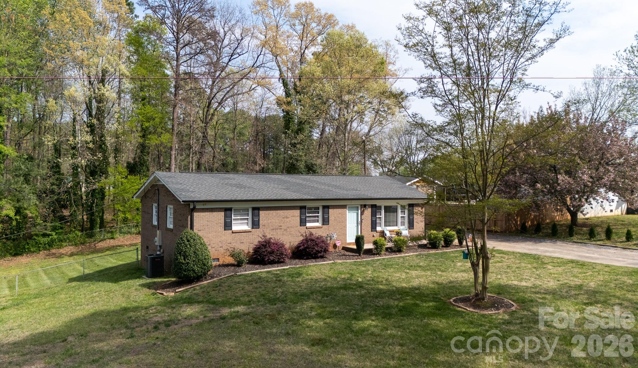 ALL BRICK! LARGE FENCE LOT! MOVE IN READY!  This home in a desirable no HOA community is convenient to grocery, golf driving range and minutes from I85 for easy commuting to Airport, uptown Charlotte, Gastonia and etc.  Inside you will find a family room with bay window and open concept kitchen w/ dining seating by the kitchen work station. The kitchen has granite countertops and a work island along with stainless appliances.  (2025) flooring throughout - no carpet, (2025) HVAC, (2020) roof, (2026) water heater - ALL provide peace of mind that the big price ticket items have been take care of!   The back yard is fenced and the large storage shed will stay.  There is an extended concrete back patio and raised bed garden spot!  This home is a hard to find treasure and is move in ready in a highly desire able location!  Don't wait!