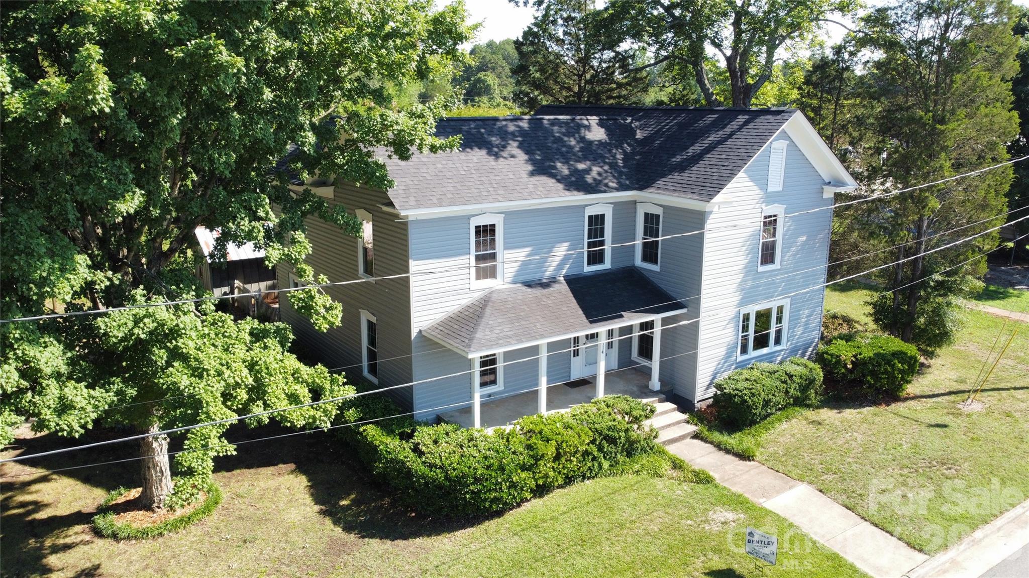 Step into something truly special. Dating back to 1881 (according to history books), this stately and beautifully maintained home blends historic charm with thoughtful modern updates. Offering the peaceful feel of the countryside while remaining just a short walk from the heart of Downtown China Grove.

Inside, you will find refinished hardwood floors throughout (a mix of original and new), fresh paint, and new LVT in the kitchen and downstairs bathroom. The layout offers four spacious bedrooms and two full baths, with one upstairs bedroom featuring a large adjoining room full of potential, whether you envision a walk-in closet, a sitting room, or the primary suite of your dreams.

Step outside and discover your own private oasis. A serene screened back porch invites you to slow down and take it all in, while the mostly fenced backyard is shaded by mature pecan trees and offers multiple outdoor storage options. The detached carport provides parking, lower level storage, and a bonus upper level that is  ready for storage or could be finished for additional living space (to be verified).

The exterior of the home was updated in 2026 with new double hung, double pane windows, new vinyl siding, and freshly painted foundation. In 2024, a new roof was installed. 

Homes with this much character, space, and history rarely come available. Do not miss your chance to own a true piece of China Grove's story.