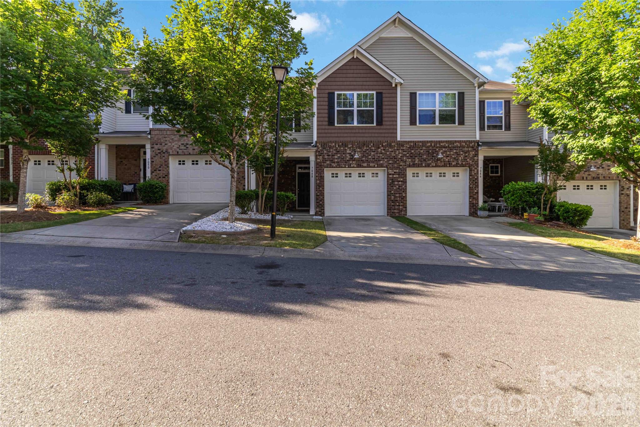Welcome to this beautifully designed townhouse offering 3 bedrooms and 2.5 baths with an open floor plan and ample storage throughout. The main level features a spacious great room with a fireplace, a bright dining area, and a well-appointed kitchen complete with stainless steel appliances, a gas range, breakfast bar, and abundant cabinet space, including a new microwave, dishwasher, and disposal. Enjoy outdoor living from the covered front porch and covered patio.

Upstairs, the primary suite features a tray ceiling and an ensuite bath with a tiled shower and separate garden tub. Two additional bedrooms and a conveniently located laundry room complete the upper level. A new water heater adds additional peace of mind.

Community amenities include a pool, sidewalks, and street lights. Conveniently located near shopping, dining, and everyday conveniences.
