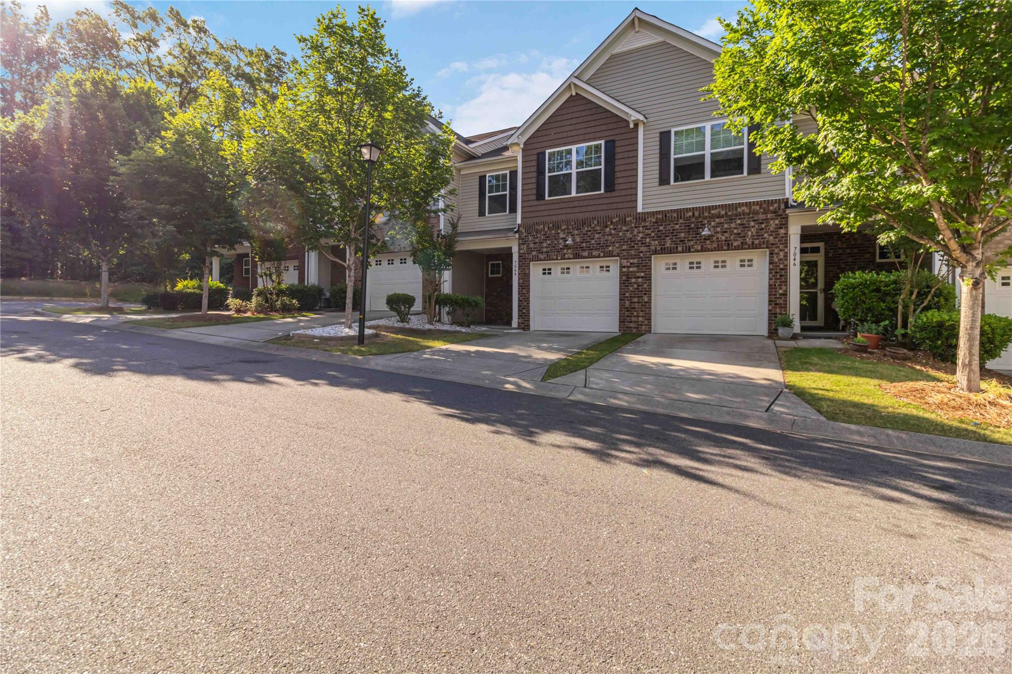 Welcome to this beautifully designed townhouse offering 3 bedrooms and 2.5 baths with an open floor plan and ample storage throughout. The main level features a spacious great room with a fireplace, a bright dining area, and a well-appointed kitchen complete with stainless steel appliances, a gas range, breakfast bar, and abundant cabinet space, including a new microwave, dishwasher, and disposal. Enjoy outdoor living from the covered front porch and covered patio.

Upstairs, the primary suite features a tray ceiling and an ensuite bath with a tiled shower and separate garden tub. Two additional bedrooms and a conveniently located laundry room complete the upper level. A new water heater adds additional peace of mind.

Community amenities include a pool, sidewalks, and street lights. Conveniently located near shopping, dining, and everyday conveniences.