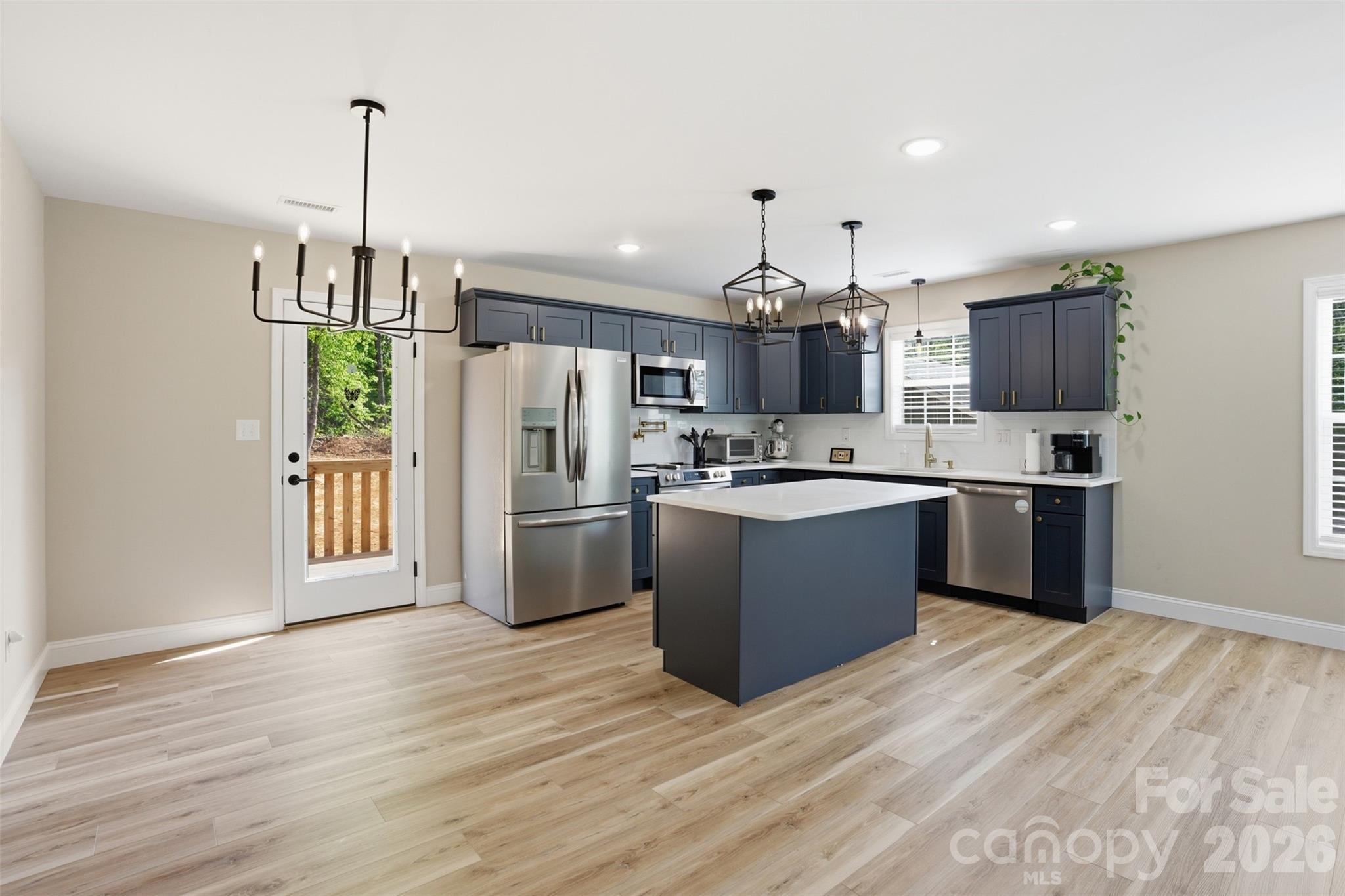 Price Drop! Listed for less than owner has in it- our loss is your gain.
Less than a year old, this Granite Falls home offers a move-in ready option without the wait of new construction.
The main level features an open layout that flows easily into the kitchen, complete with shaker-style cabinetry, quartz countertops, stainless steel appliances, and a center island ideal for everyday living and entertaining. The split-bedroom design provides added privacy, with the primary suite offering a walk-in closet and private bath.
The lower level adds valuable flexibility with additional living space, and what could be used as a fourth bedroom.
Recent improvements include an expanded concrete driveway and finished grading, giving the exterior a more complete, ready-to-enjoy feel.
With everything less than a year old, this home offers a low-maintenance option in a growing Granite Falls location.