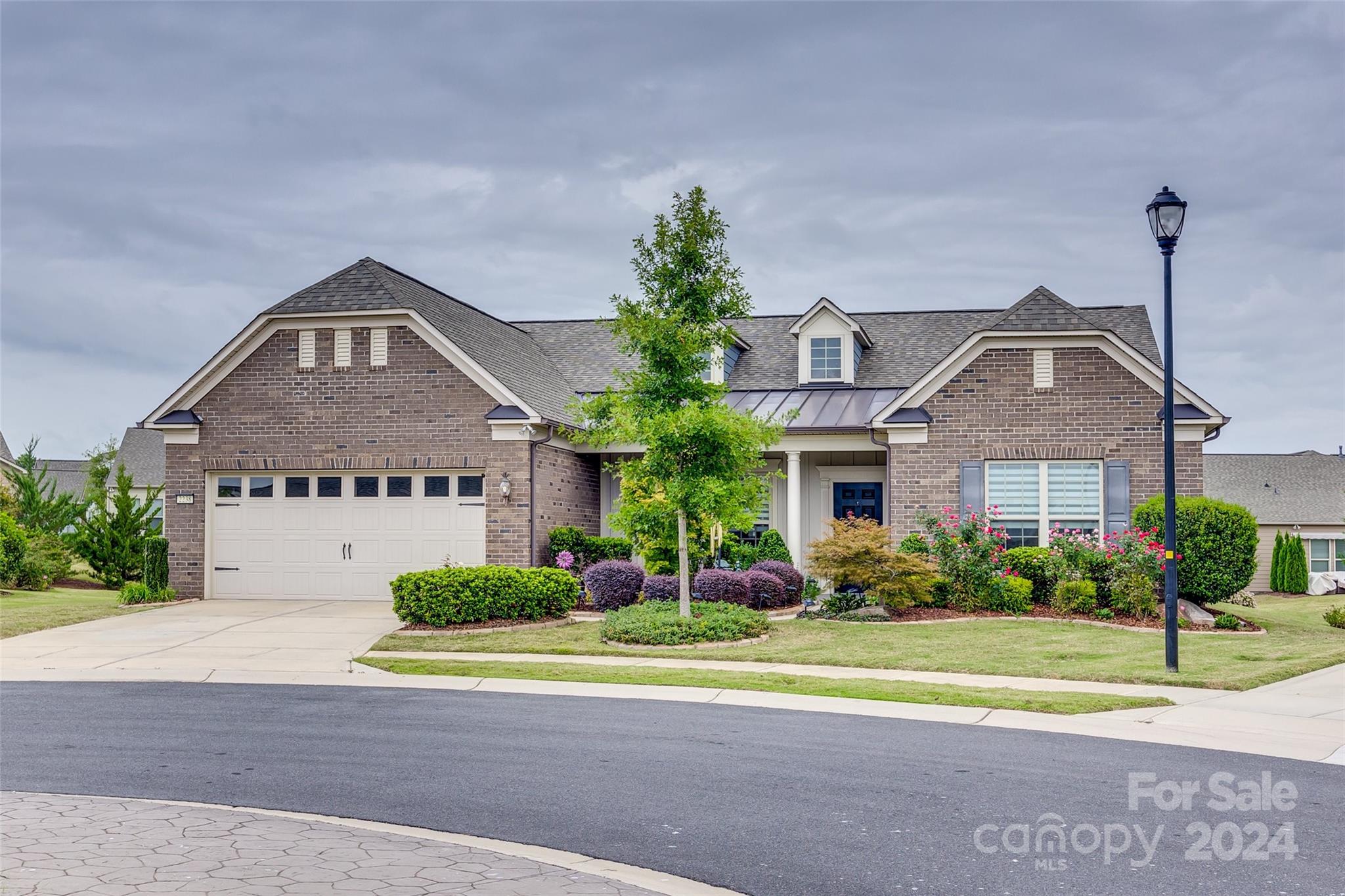 One level living at its finest! Tangerly Oak model in the Award-winning 55+ community of Carolina Orchards. 2BR 2.5BA + Office. Both bedrooms considered Primary. Open concept living is centered around the upgraded kitchen w/ gas range. Living room has stone fireplace. Sunroom, screened porch, and patio all overlook the .29 acres w/views of pond. Laundry room with passthrough to the Primary walk-in closet. 2 car garage w/ additional tandem golfcart garage make this a handyman/hobbyist dream. Lawn maintenance included. In this community, residents have access to a range of amenities tailored to an active & social lifestyle. This includes a clubhouse, fitness center, indoor & outdoor swimming pools, 4 tennis cts, 8 pickleball cts, bocce ball, dog park, playground, & various social activities to enjoy with like-minded neighbors. Community has on-site Lifestyle Coordinator! You don't want to miss this beautiful home in an amazing community! Professional photos and measurements coming soon!