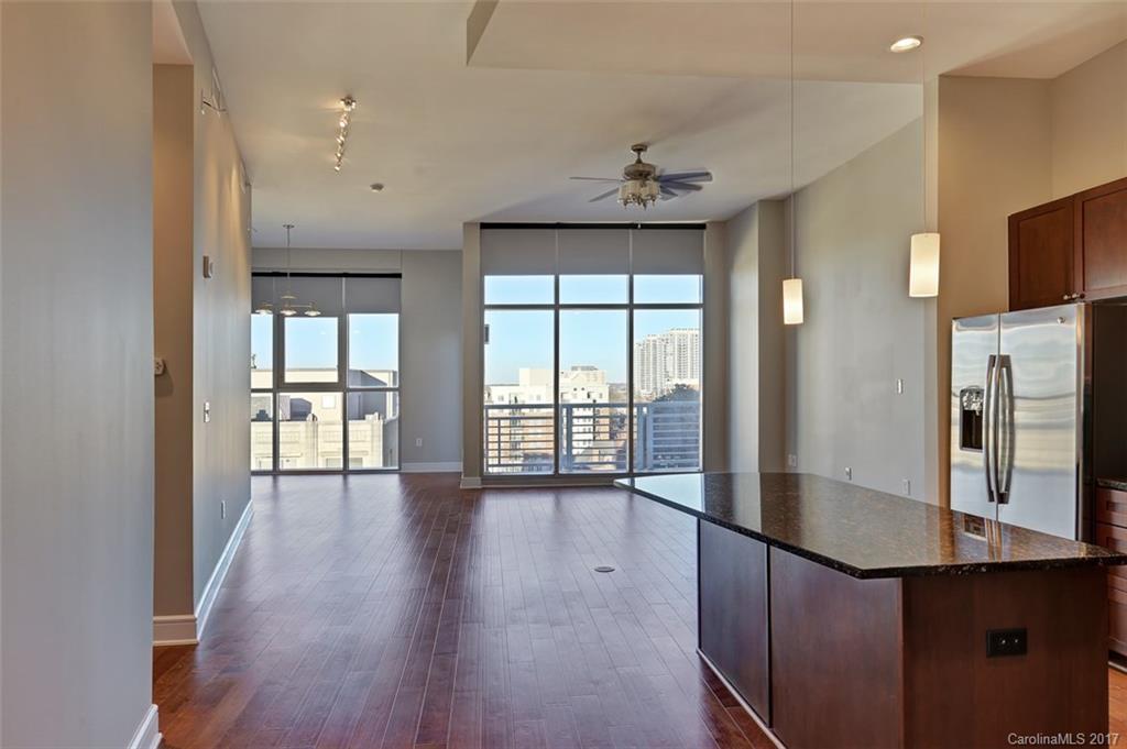 Renovated Uptown Condo! Rare 2 bedroom end unit which includes a den for an office with a great view of the Knights Stadium. Features include: Granite counter tops, New hardwood floors, Fresh paint, New GE stainless steel appliances, Wet bar, Remote control window blinds, Balcony view of the city, 2 Reserved garage parking spaces, Unit is located on same floor as all amenities offered: Pool and Grill, Workout facility, Clubhouse that can be reserved for special events. Property won't last long!
