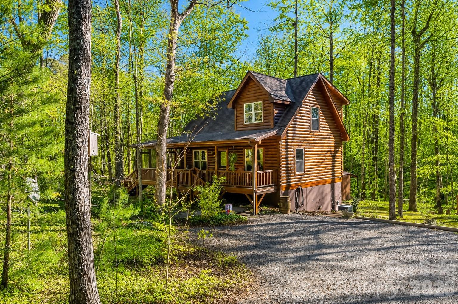 Tucked away on 3.7 private wooded acres, 204 Mountain Vista Dr. offers the perfect blend of rustic charm and comfortable mountain living in the gated Grandview Peaks community of Nebo, NC. This inviting log cabin is nestled in the woods, creating a peaceful retreat where nature and privacy take center stage.
Inside, the open floor plan features warm hardwood floors, soaring ceilings, and a cozy yet spacious great room ideal for relaxing or entertaining. The well-appointed kitchen includes granite countertops for both style and functionality. The main level offers one bedroom and one full bath, along with comfortable living spaces that flow easily to the screened porch—perfect for enjoying the sights and sounds of the forest year-round.

Upstairs, a loft overlooks the great room and leads to the primary owner’s suite with a full bath, creating a private upper-level retreat. 

The finished basement provides an additional bedroom suite with a full bath, ideal for guests, extended family, or recreation space (currently set up with bunk beds and den furniture).

With three bedrooms, three full baths, and multiple living areas, this home offers flexibility for full-time living, a mountain getaway, or an income-producing retreat. Grandview Peaks residents enjoy a private lake with beach area, pavilion with outdoor kitchen and fireplace, recreation area, and scenic walking trails—all just minutes from Marion, Morganton, Lake James, and the best of Western North Carolina.