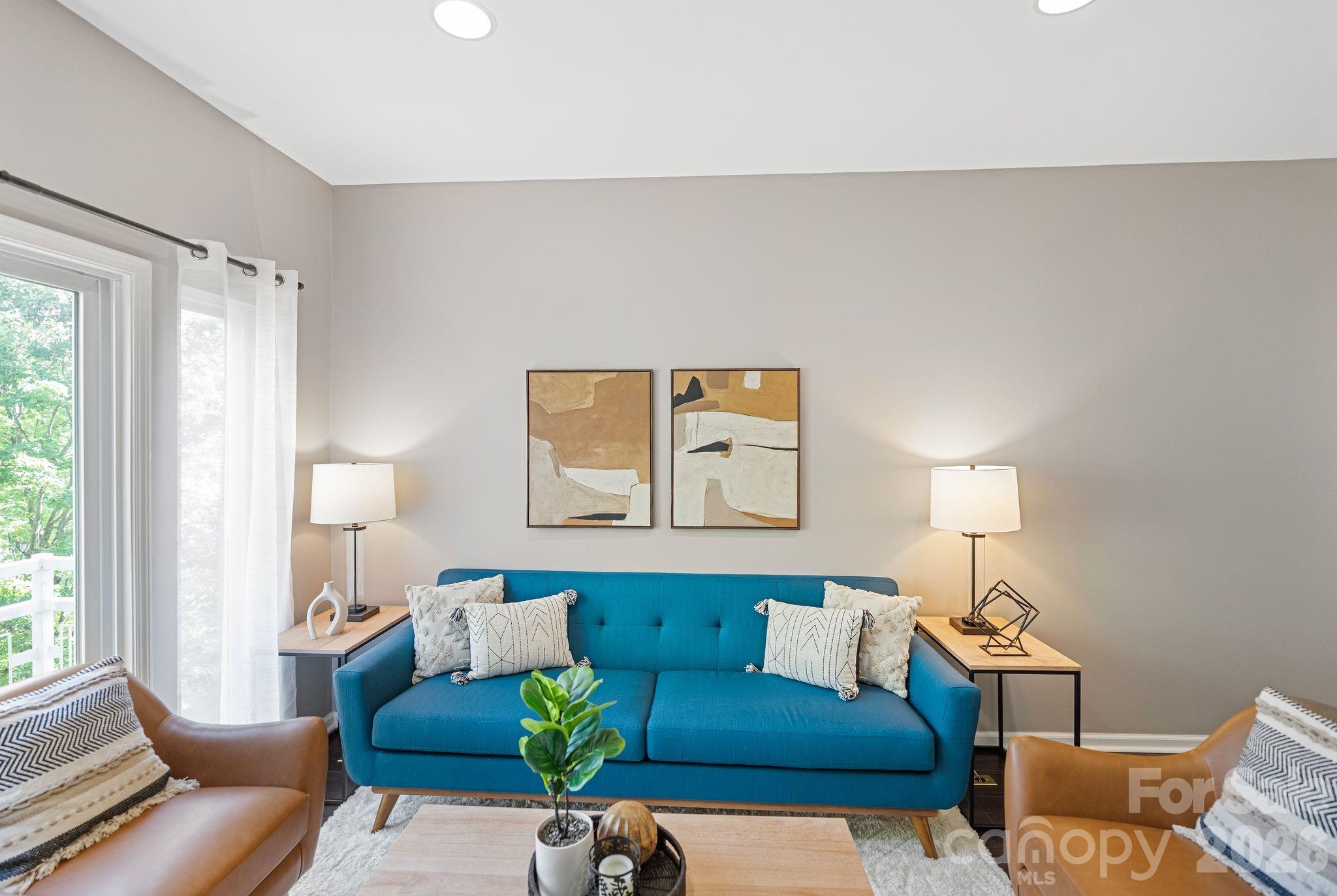 Welcome to this two-story condo in the heart of NoDa! Freshly painted in 2026, this home is truly move-in ready. The kitchen features granite countertops, brand-new stainless steel appliances including a new dishwasher, electric range and disposal (2026) with access to a conveniently located half bath and laundry closet with new LVP flooring (2026). This opens into the dining area and living room, creating an ideal space for everyday living and entertaining. Upstairs, you’ll find newly installed carpet throughout and two ensuite bedrooms. The primary suite offers two closets for added storage, new ceiling fan (2026), and an ensuite bath with a double vanity, tub/shower combination, new plumbing fixtures, new electrical fixtures and new LVP flooring (2026). The second bedroom also features new carpet, new ceiling fan, and an ensuite bath with new plumbing fixtures, new lighting fixtures, new LVP flooring (2026) and a single vanity. Additional updates include HVAC (2021), roof replacement (2025) and new blinds (2026). Residents enjoy access to a community outdoor pool and with close proximity to the 36th Street Light Rail Station you will have easy access to Uptown, South End, and UNC Charlotte. You’ll also love being close to NoDa’s vibrant scene, with popular restaurants, breweries, gyms, and shops just around the corner. Come experience everything this fantastic NoDa condo has to offer!