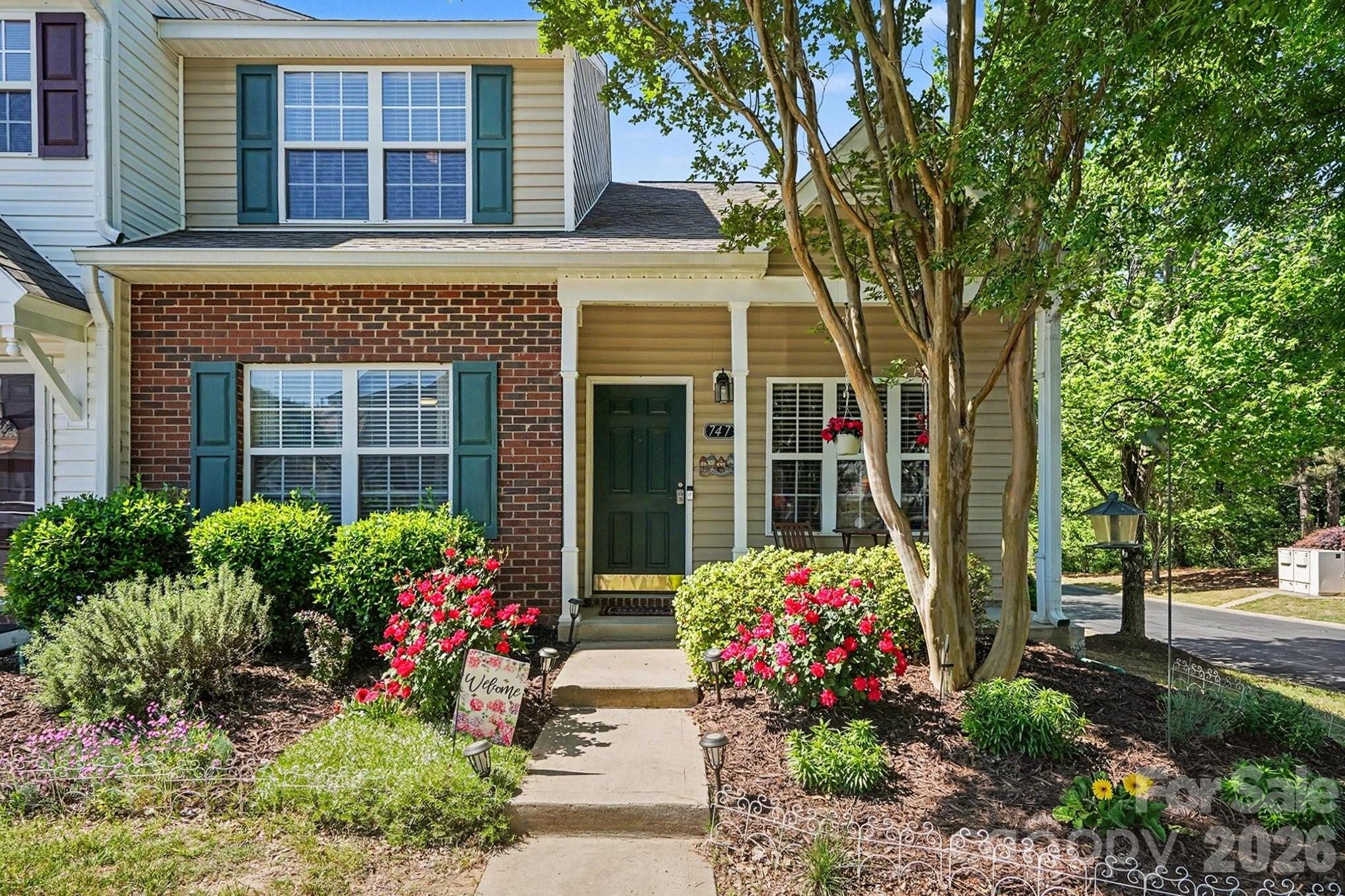 This charming end-unit townhome is a hidden gem that perfectly blends comfort, style, and convenience. Featuring 3 bedrooms and 2.5 bathrooms, this home offers plenty of space to live, work, and relax. The main-level primary suite ensures easy living, while the open-concept layout creates an inviting and functional atmosphere. Step into the eat-in kitchen, where granite countertops and a breakfast bar make both cooking and casual dining a delight. The luxury vinyl plank floors throughout add a modern touch and are as durable as they are beautiful. Outdoors, you'll find a private back deck surrounded by lush greenery—perfect for morning coffee, evening cocktails, or hosting friends. The covered front porch is equally inviting, offering a cozy spot to unwind and enjoy the neighborhood charm. This townhome comes with the added perk of a low & proactive HOA, which covers lawn maintenance and grants access to a community pool—making your lifestyle as carefree as it is enjoyable. Located just minutes from I-77 and South Charlotte, you'll have seamless access to shopping, dining, and entertainment, all while being nestled in the highly rated Fort Mill school district. The low South Carolina taxes make this not just a home, but a smart investment. Move-in ready and meticulously maintained, this home is waiting for you to make it yours!