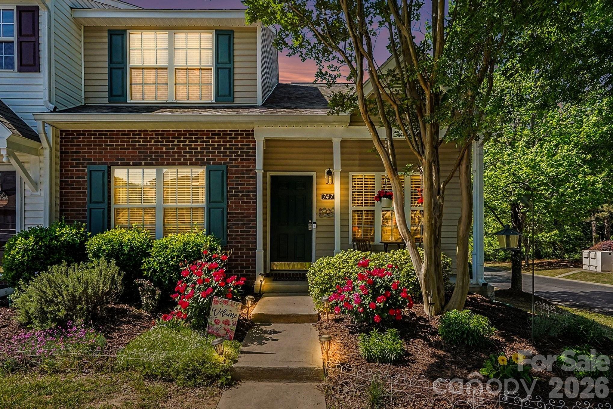 This charming end-unit townhome is a hidden gem that perfectly blends comfort, style, and convenience. Featuring 3 bedrooms and 2.5 bathrooms, this home offers plenty of space to live, work, and relax. The main-level primary suite ensures easy living, while the open-concept layout creates an inviting and functional atmosphere. Step into the eat-in kitchen, where granite countertops and a breakfast bar make both cooking and casual dining a delight. The luxury vinyl plank floors throughout add a modern touch and are as durable as they are beautiful. Outdoors, you'll find a private back deck surrounded by lush greenery—perfect for morning coffee, evening cocktails, or hosting friends. The covered front porch is equally inviting, offering a cozy spot to unwind and enjoy the neighborhood charm. This townhome comes with the added perk of a low & proactive HOA, which covers lawn maintenance and grants access to a community pool—making your lifestyle as carefree as it is enjoyable. Located just minutes from I-77 and South Charlotte, you'll have seamless access to shopping, dining, and entertainment, all while being nestled in the highly rated Fort Mill school district. The low South Carolina taxes make this not just a home, but a smart investment. Move-in ready and meticulously maintained, this home is waiting for you to make it yours!