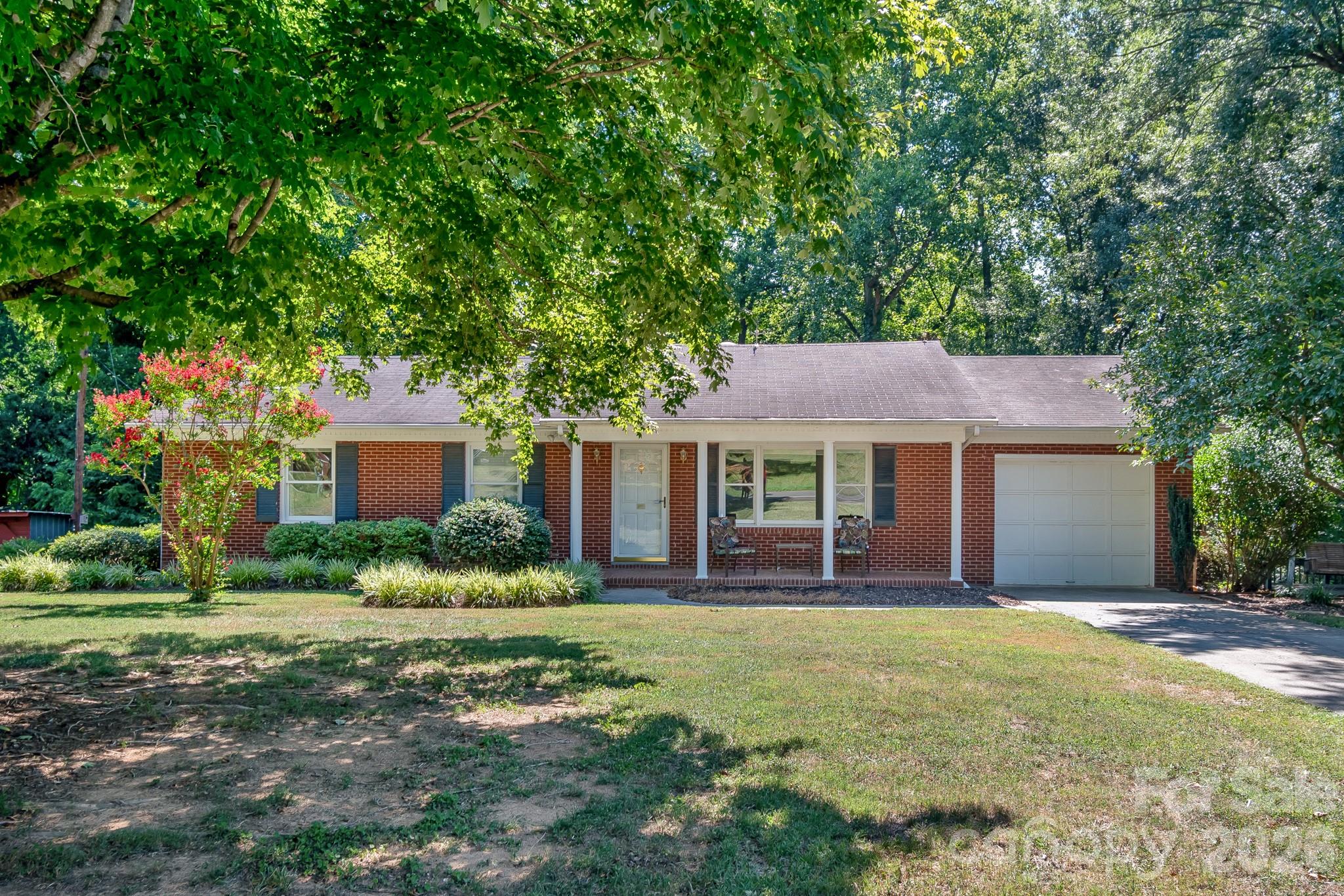 Welcome to peaceful country living in this lovingly maintained brick ranch, owned by the same family since it was built! Beautiful hardwood floors flow throughout the home, while the kitchen, dining area, and great room offer tranquil views of the wooded backyard. Enjoy your morning coffee on the inviting front porch or unwind with a glass of lemonade on the recently resurfaced back deck overlooking the private backyard. The spacious second living area offers endless possibilities for a home office, playroom, media room, etc. A generous laundry/utility area provides abundant storage, and outside you'll find a large detached workshop, storage shed, and patio perfect for entertaining. Home is located within Unionville/Piedmont School District. If you've been searching for a home that offers timeless charm, flexible living space, and the serenity of country living, this is one you won't want to miss!