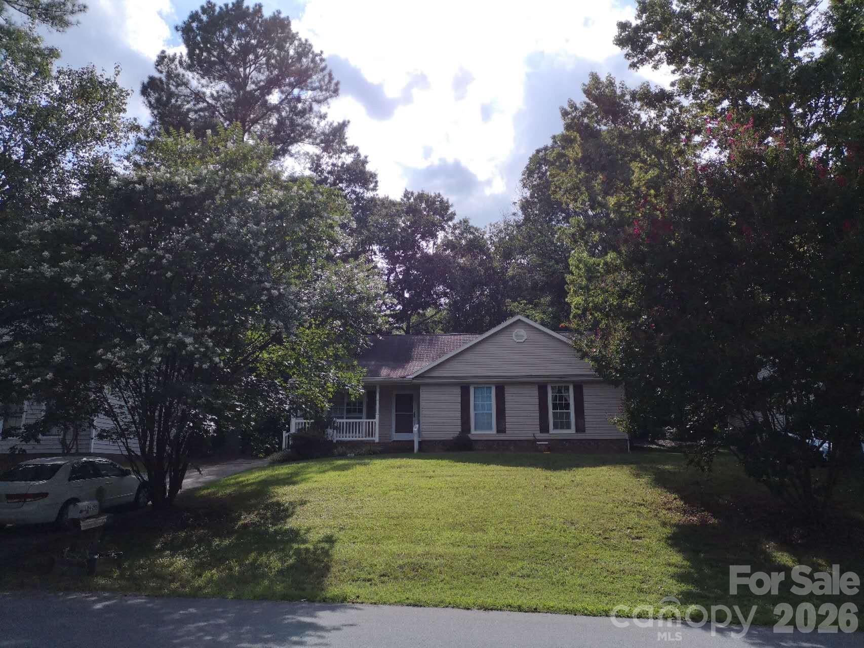 Charming ranch home situated on a generous lot in an established Charlotte neighborhood. This well-maintained 3-bed, 2-bath property offers comfortable living with a traditional, functional layout. The inviting living room features a cozy brick fireplace that adds warmth and timeless character. The kitchen and dining area provide ample cabinet space and an easy setup for everyday meals or family gatherings. All bedrooms are generously sized with great natural light, and the full baths are conveniently arranged for daily living.
Outside, the large backyard offers plenty of room for gardening, outdoor entertaining, or future expansion possibilities. The home is also located within one of the best school systems in the area, adding to its long-term appeal. If desired, the sellers are willing to leave the furniture for the buyers.