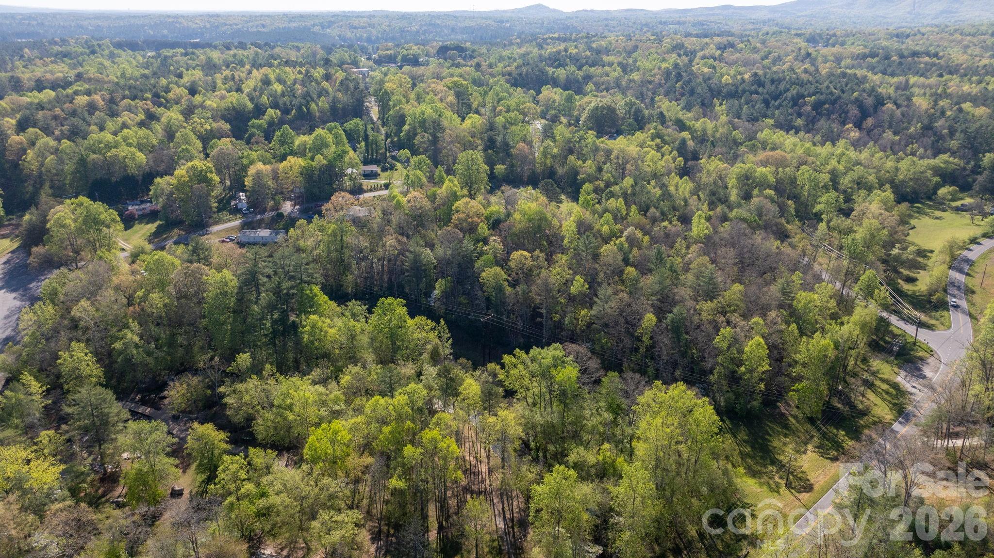 Nestled in a peaceful rural setting adjacent to McGalliard Falls, this beautiful 9.5-acre tract offers the perfect blend of privacy, natural charm, and everyday convenience. With road frontage on two sides, the property provides flexible access points and excellent potential for multiple homesites or a private estate layout. A gentle stream winding through the edge of the land, adding a serene backdrop and enhancing the property’s natural appeal. Water is available at the road, making it easier to bring your vision to life, whether you’re planning to build now or invest for the future. Enjoy the quiet of the countryside while still being just a short drive to town for shopping, dining, and schools. Benefit from country living with no city taxes—giving you more freedom and value in a truly desirable location. Don't miss out on this beautiful, one of a kind piece of property. Schedule your showing today!!