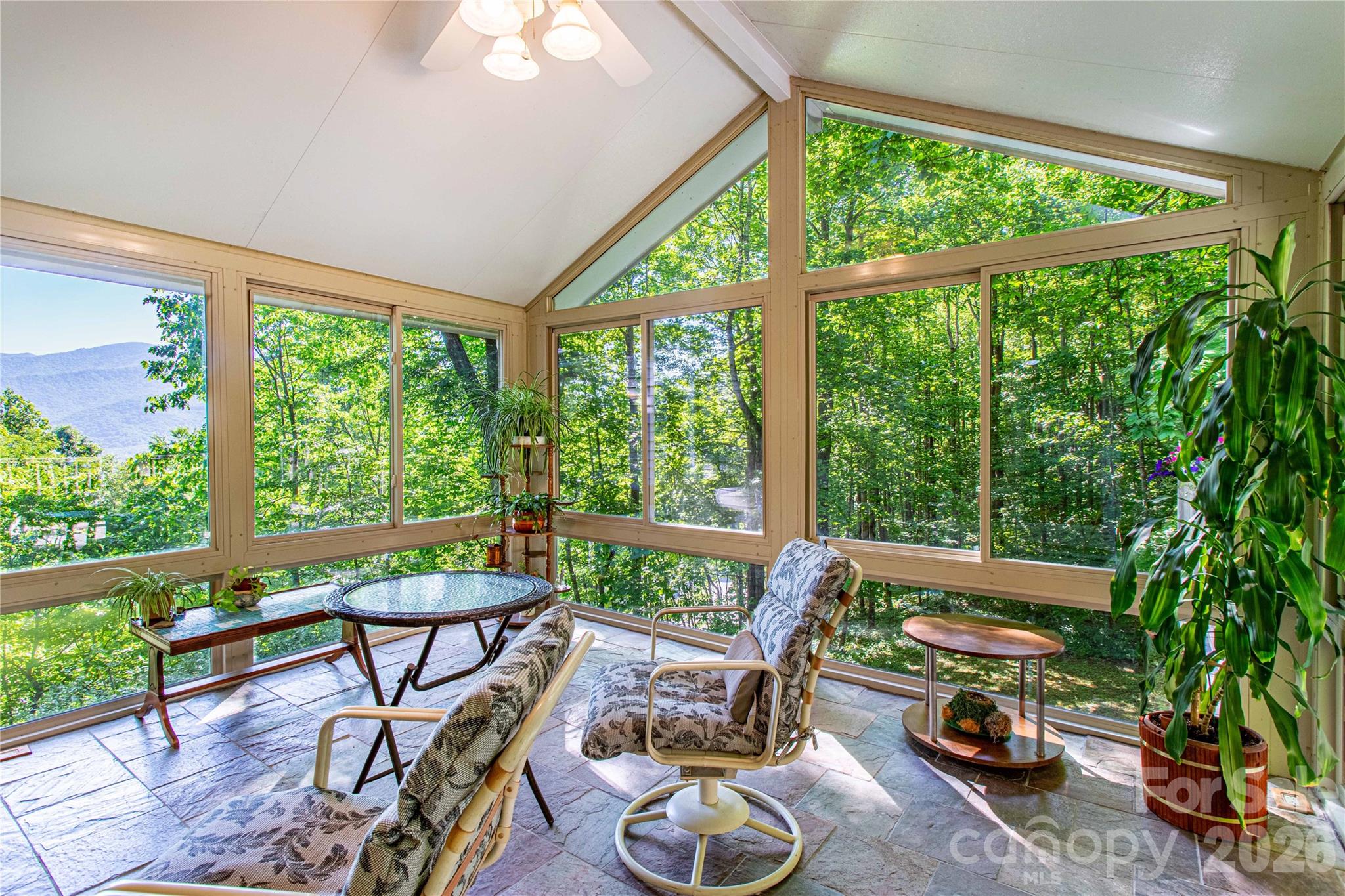 Looking for a house with year-round mountain views and a gentle driveway? Oh, and priced below $800K in a private, gated neighborhood of $1million+ executive homes with high-speed internet that allows short-term rentals? All this and minutes to downtown Black Mountain and I-40. THIS BEAUTIFUL HOUSE IS THE MOUNTAIN HOME YOU'VE WANTED. Whether you are looking for a savvy investment opportunity, multigenerational living, or your dream house in the mountains, this house is a must see! In winter/early spring, you will enjoy views of the Burnett Reservoir and in the spring/summer you'll have more privacy and still enjoy mountain views. You'll also enjoy the radiant heated floors in your sunroom and lovely gas log fireplace in your living room with wood floors. Entertainment deck with built-in seating, possible downstairs apartment, den/office and another flex room on the main, full bath and laundry room on the main, main level eat-in kitchen with granite countertops, plenty of cabinets and storage, gleaming wood floors, and a jetted tub in the primary bath are just a few of the highlights of this beautiful home. Book your showing today!