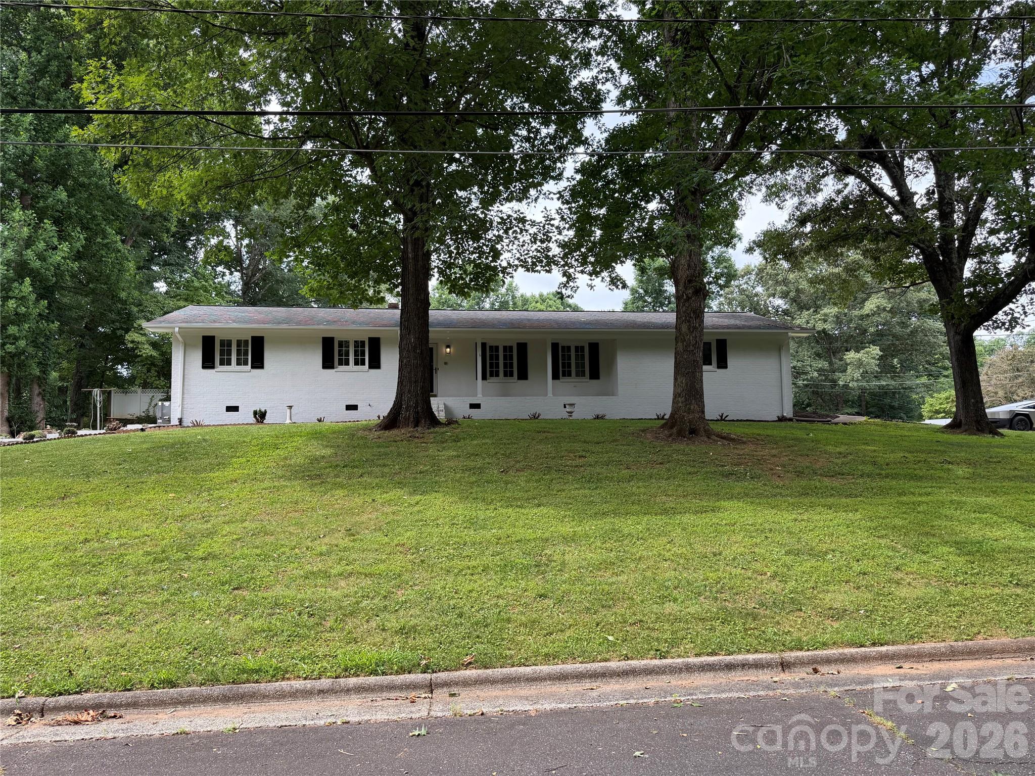 Nice updated brick home in great neighborhood! The kitchen features new white shaker cabinets and granite countertops with a serving/seating area which is open to the family room with a fireplace.  Nice sized sun room on back of the home is a great place for morning coffee and reading. New LVP flooring throughout the home and fresh neutral paint.  The home has a 2 car garage and also a one car garage and work shop in the basement.