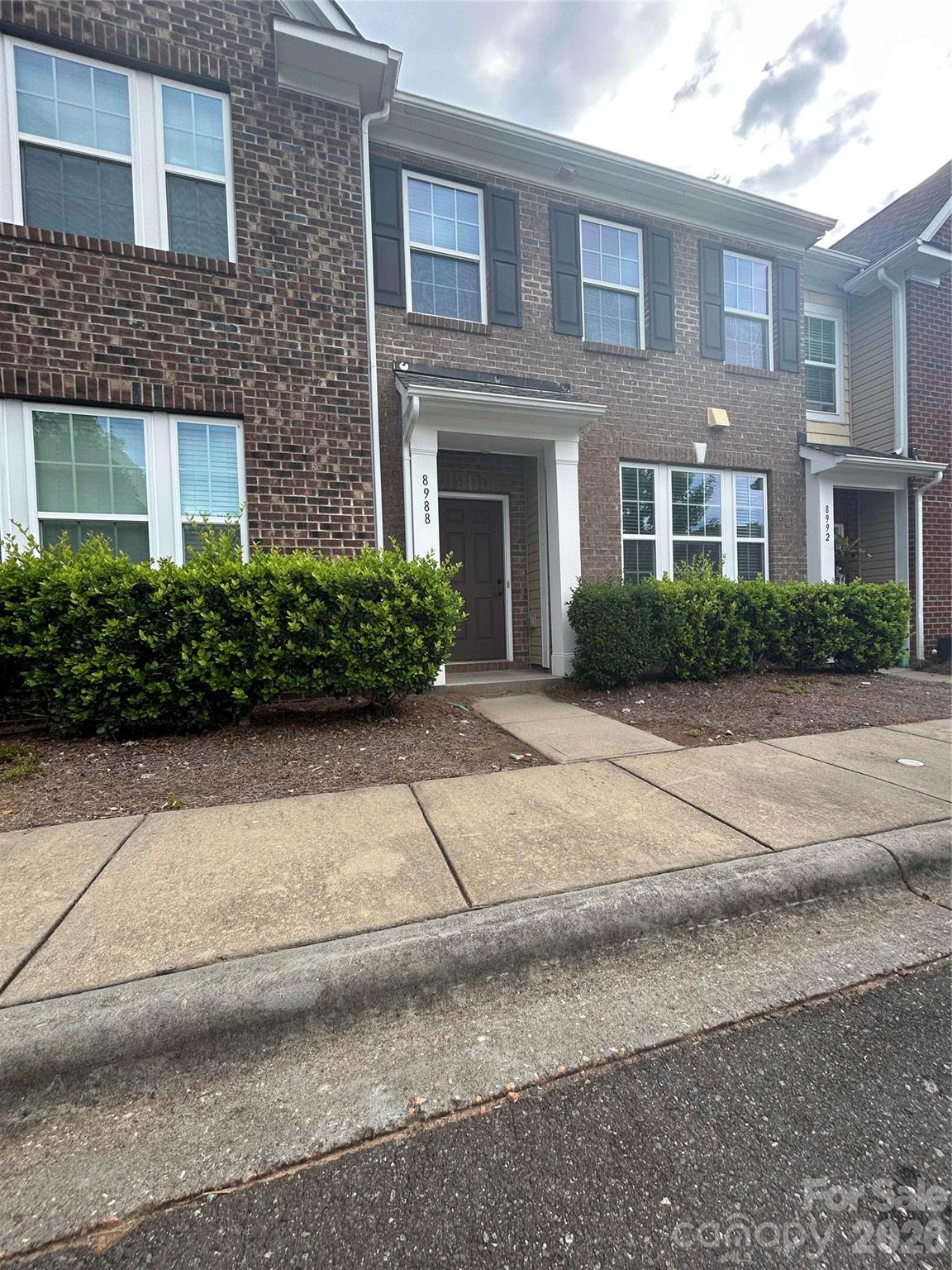 Tucked into the sought-after Almond Glen community, this move-in-ready townhome pairs an open, light-filled floor plan with a private backyard that backs to a wooded natural area—a peaceful retreat right out your back door. Inside, the main level shines with a well-appointed kitchen featuring granite counters, stainless steel appliances, a tiled backsplash, pantry, and a center island that opens to the breakfast area and living room, so you're never far from the conversation. A cozy gas fireplace anchors the family room and frames views of the backyard. Upstairs offers a smart split-bedroom layout with a spacious primary suite—walk-in closet, dual vanities, and a tiled shower with a separate soaking tub—plus secondary bedrooms and a convenient laundry room. Residents enjoy Almond Glen's pool and clubhouse, all minutes from I-77, Ballantyne, dining, and shopping. The refrigerator conveys—come see it today. Measurements from original builder specs, sqft may differ - will be professionally measured.