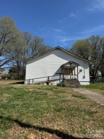 Conveniently located less than 1.5 miles from historic downtown Statesville and under half a mile from the new Woody Woodard Memorial Fire Station, this vacant church property sits on approximately 0.24 acres and presents a rare conversion opportunity.

The building offers approximately 1,982 square feet plus a covered porch and features a flexible floor plan including a large sanctuary, multiple classrooms, vestibules, restrooms, and hallways. The layout provides a variety of possibilities for renovation, creative reuse, or residential reimagining.

The property is connected to city water and city sewer with tap fees already paid, reducing upfront development costs for future improvements. Zoned R-5MFM (High Density Multi-Family Residential District), the area supports various residential uses including attached and detached housing types, subject to city regulations and approval.
The seller is also open to selling the adjacent off-market parcel, providing an additional opportunity for expansion, redevelopment, or increased land footprint.

This unique property offers both a renovation project and strong investment opportunity for buyers looking to restore the structure or transform the space into something entirely new.

Please inquire about details on Build on your Lot pricing and floor plans. Great opportunity! 1311 and 1319 7th Street can be purchased individually or as a package - the lots listed together are under MLS 4347402.
Seller is a licensed North Carolina real estate agent.