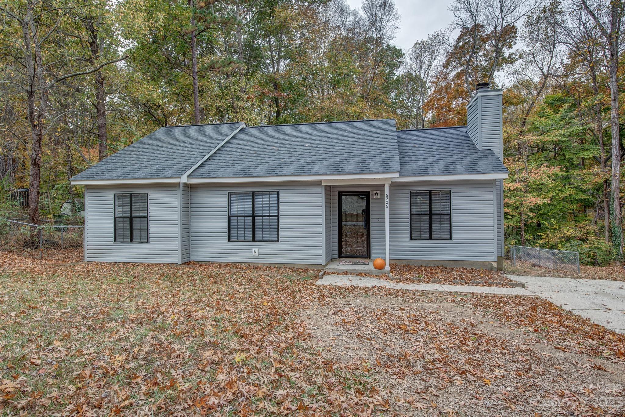 WELCOME HOME to this beautiful and freshly renovated 3-bedroom, 2-bathroom ranch. Move in ready featuring a nice open floor plan with vaulted ceilings in a large living room perfect for entertaining. The kitchen includes an abundance of cabinets, new countertops, stainless steel appliances, and dining area. Luxury EVP flooring throughout and all new light fixtures. Also includes a fully fenced and beautiful wooded area for your private back yard view. Short distance to grocery, restaurants, and schools.
