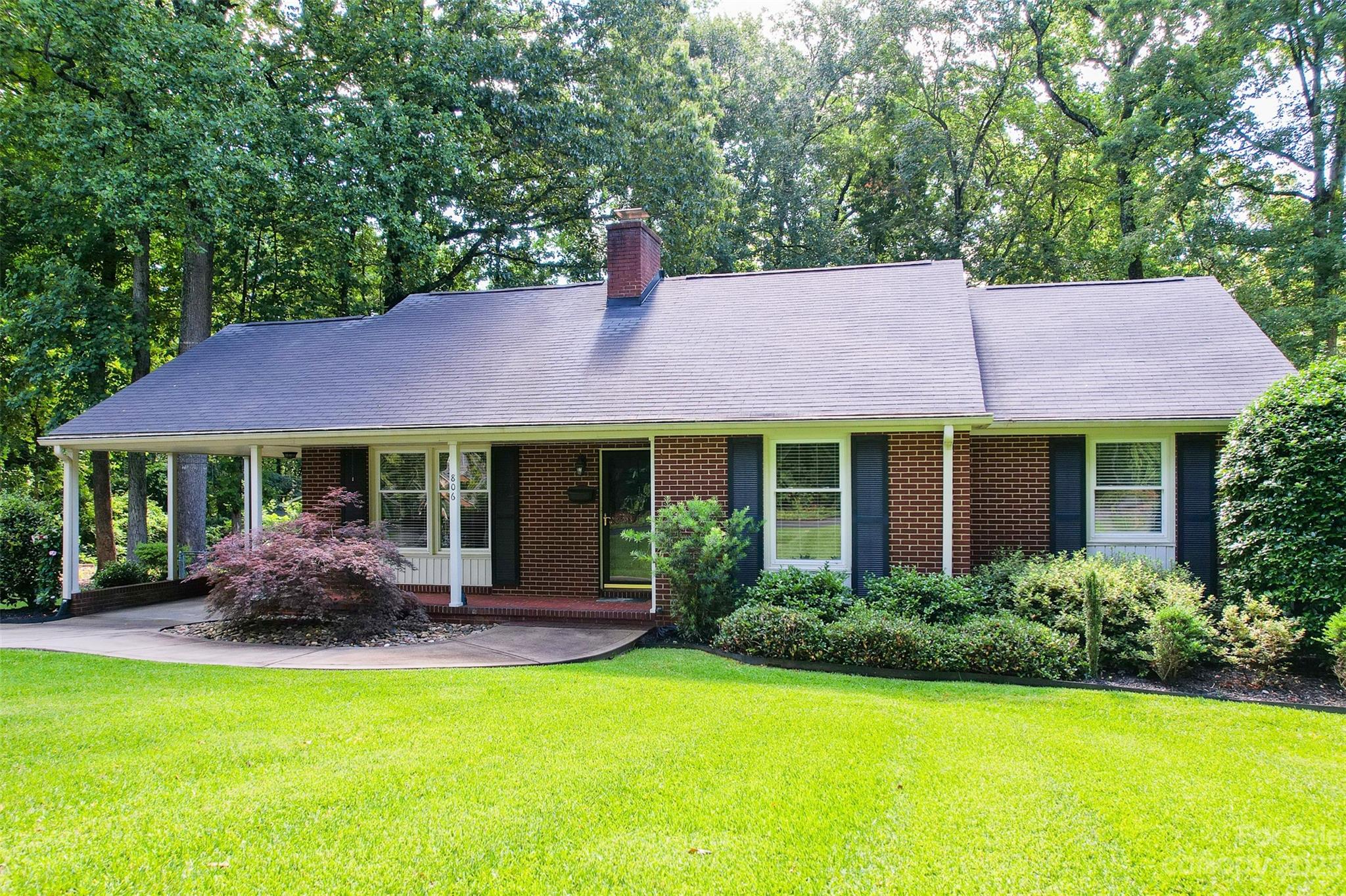 Meticulously cared for home in the desirable Whiteville Park neighborhood. No HOA and rare double parcel 1/2 acre lot! Enjoy the gorgeous landscaping and large front porch facing wooded views. This brick one-story home is move- in ready with upgrades throughout! Beautiful original hardwood floors, new paint throughout, updated kitchen, updated bathrooms AND brand new deck. The kitchen has white soft close cabinetry and stainless steel appliances with a ton of natural light. Each bedroom has double closets for plenty of storage space. The living room opens into the dining room, perfect for entertaining! Enjoy the fully fenced tree-lined backyard as you relax on the back deck. Close proximity to downtown Fort Mill that offers restaurants, shopping and frequent events! Don't let this beauty get away.