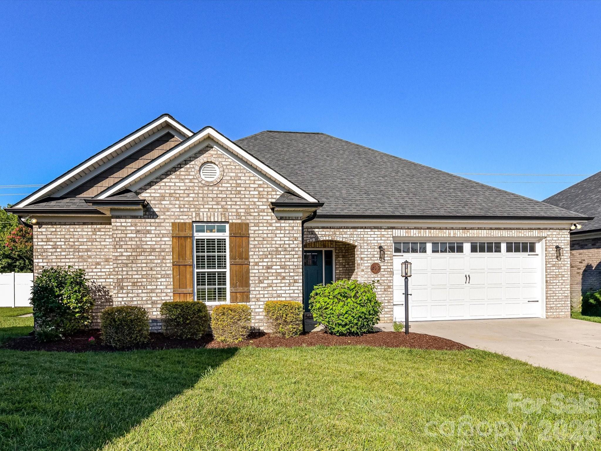 Custom-built in 2019, this full brick home offers the perfect blend of quality craftsmanship and modern comfort with an open floorplan! Featuring 3 bedrooms and 2 baths, the thoughtfully designed split-bedroom floor plan provides both privacy and functionality. The inviting den boasts vaulted ceilings and an electric fireplace, creating a warm and open living space.
The kitchen is well-appointed with granite countertops, tile backsplash, stainless steel appliances, and a pantry—ideal for both everyday living and entertaining. The primary suite includes a beautifully updated bathroom with a dual sink vanity and a brand-new marble shower. All appliances:  refrigerator, washer and dryer convey with the home.
Prefinished wood flooring enhances the main living areas, adding warmth and style throughout. Step outside to enjoy the patio and partially fenced backyard with a white vinyl privacy fence along the rear of the property.
Located on a cul-de-sac lot in a highly desirable neighborhood with sidewalks and street lighting, this home offers convenience and charm—with NO HOA!