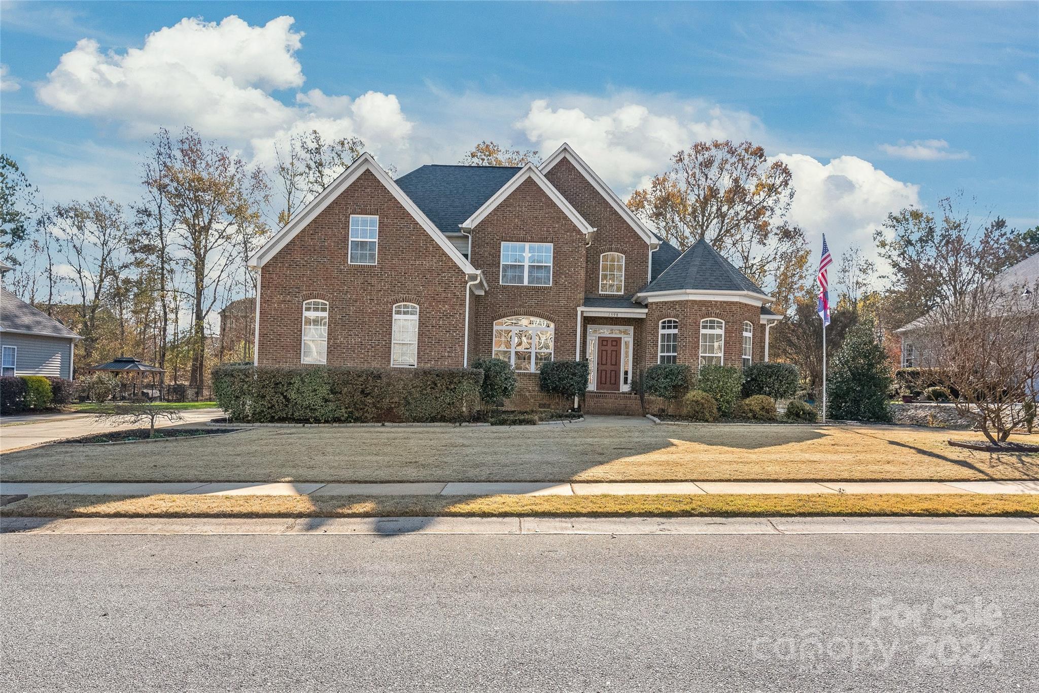 Welcome to this breathtaking Stoneridge Lakes home that features great architectural design on 1/3 acre lot with POOL. The OWNER SUITE is on MAIN level as well as 1 additional bedroom. The remodeled KITCHEN has new Quartz countertops, an island with convenient pull-out drawers. Owner bath has a jetted  soaking tub. Frosted glass laundry door adds great light. Laundry Room has utility sink and shelving. You will love the drop zone and the Butlers pantry. 3 bedrooms upstairs, one is bonus size. Enjoy the breeze in the exceptional SCREENED SUNROOM with tile flooring, outdoor ceiling fan, and doggy door. Plus a large DECK with metal railings. Lush, wooded backyard. Oversized 2-car garage with 3-ceiling mounted shelves (think storage) & driveway Pad.  Rainwater Collection/Storage System and Water Meter, to reduce irrigation cost.  TANKLESS WATER HEATER. Pool 2022, ROOF replaced 7/2021. 2 NEW HVAC units 2022. New toilets & plumbing.  Immaculate!