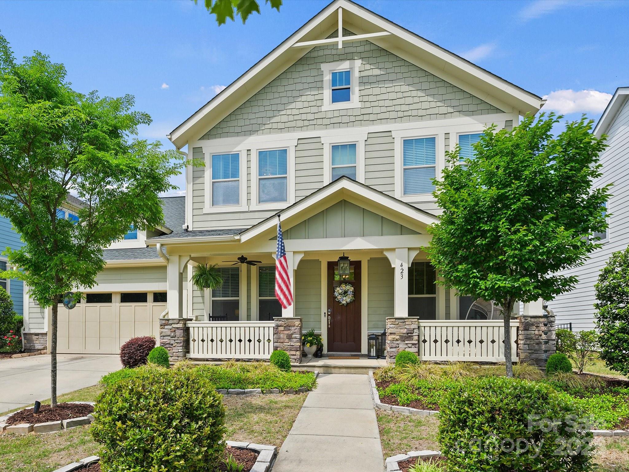 This home will capture your heart with curb appeal and impress you with upgrades.  As you enter past the office, the floorplan opens to reveal an expansive, bright gourmet kitchen with gleaming stainless steel appliances.  The custom island has seating and storage.  In the living room shiplap walls flank the fireplace and add panache.  Gorgeous light fixtures continue through into the breakfast nook that leads to one of the prettiest backyards in the neighborhood.  The Lady Banks roses were just in bloom over the pergola and patio that extend beyond the covered porch.  There is a bedroom and full bath with shower on the main level past the drop zone, with the remainder on the second level.  The primary retreat is impressive with a tray ceiling & spa like bath.  Amazing community amenities include pool, clubhouse, fitness center, playground and trails, some of which lead to the Catawba River. Top rated schools, minutes to 1-77, 20 minutes to Ballantyne and 30 minutes to Uptown.