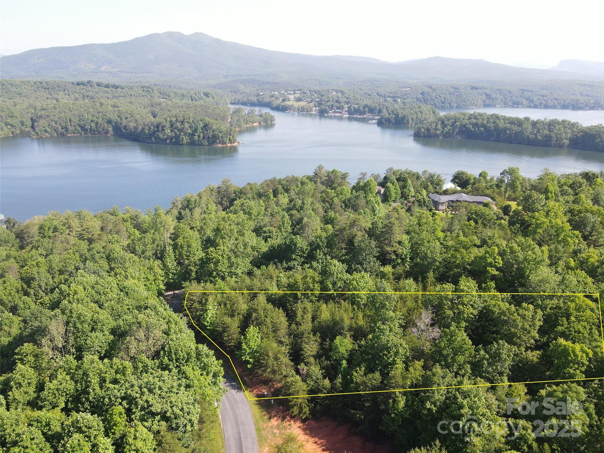 Prime Lake James Lot in The Arbor – Over 1 Acre with Boat Slip & Mountain Views

Don't miss this rare opportunity to own a beautiful +/-1.12 acre lot in the Arbor at Lake James community. Perfectly laid for a homesite, this gently sloping property offers an ideal build site with seasonal mountain views and serene natural surroundings.
Enjoy lake life at its best with your dedicated boat slip, giving you quick access to the pristine waters of Lake James. Whether you're building your dream home or a vacation rental, this lot offers incredible flexibility — short-term rentals are allowed, making it a great investment opportunity.
The Arbor is a gated, private community with walking trails, a community pavilion, and underground utilities — all just a short drive to Morganton, Marion, and the Pisgah National Forest.