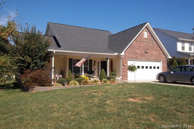 Open floor plan with kitchen/dining/living combo with cathedral ceiling.  Patio with remote controlled "sundowner" awning.  Big storage building and covered front porch.