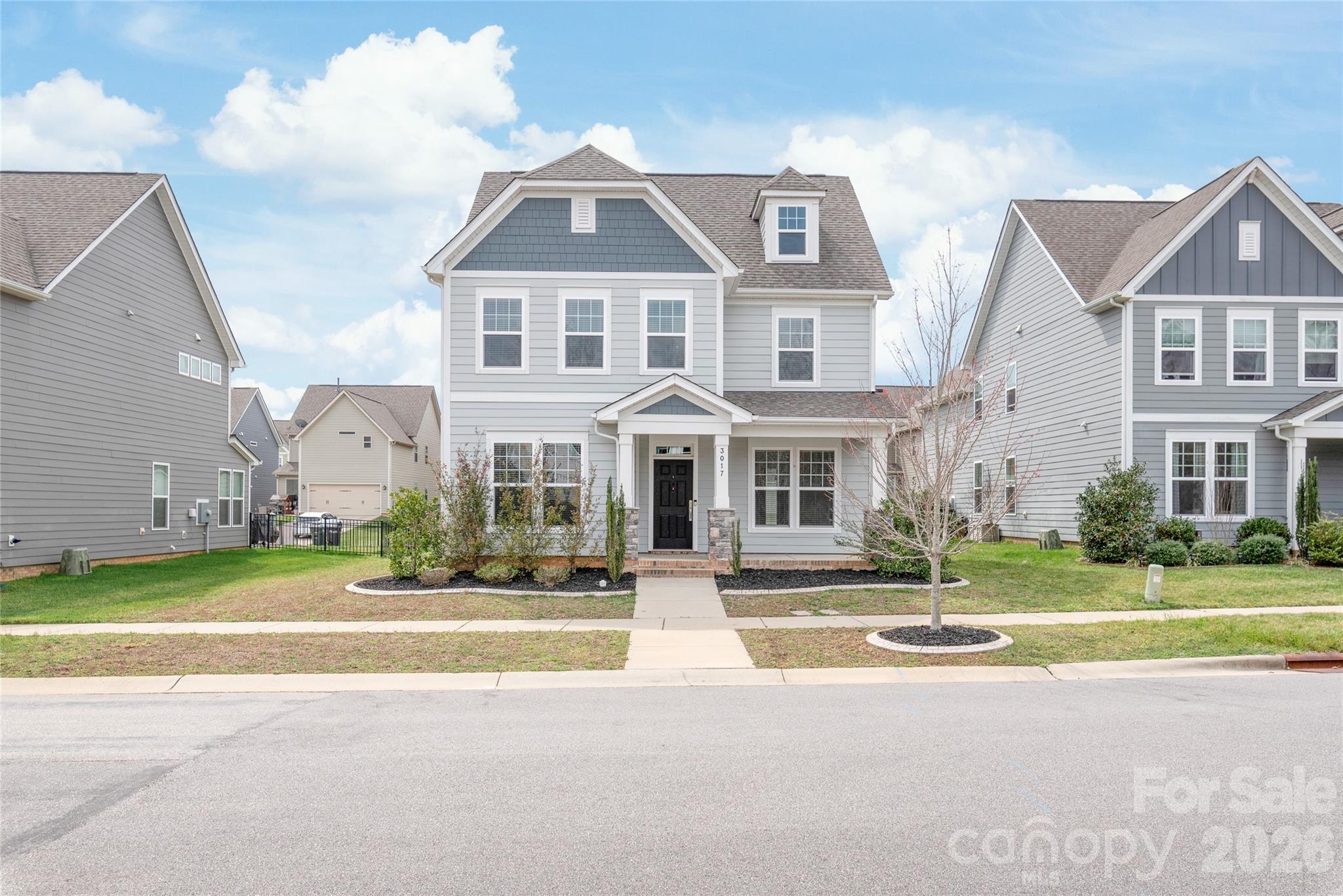Well-maintained 5-bedroom, 3-bath home with a spacious open floor plan and 9-foot ceilings on both levels. The main floor features durable LVP flooring and a modern kitchen with 42-inch white cabinets, granite countertops, a large island, and stainless steel appliances. Refrigerator, washer, and dryer are included. A main-level bedroom with a nearby full bath is ideal for guests, a home office, or multigenerational living. Upstairs offers four additional bedrooms, including a generous primary suite with ample closet space. The covered patio is perfect for relaxing or entertaining. A 2-car garage provides plenty of storage and parking. Located in a desirable community with a neighborhood pool and green spaces. Close to shopping, dining, and major highways. Don’t miss this move-in ready home - schedule your showing today!