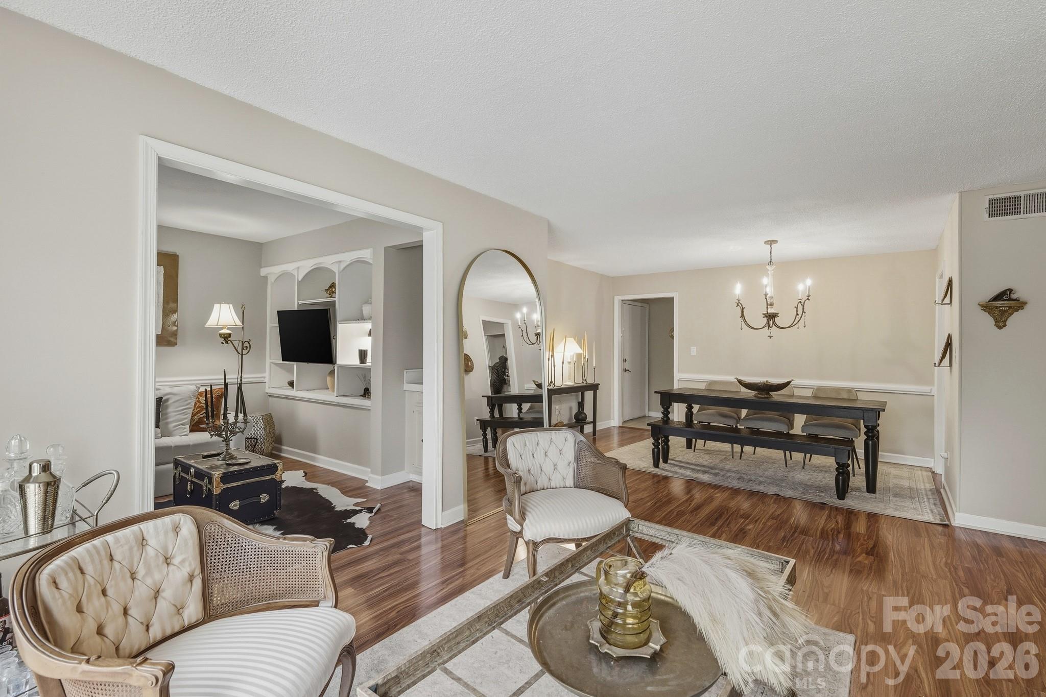 Prime location in the heart of South Charlotte with convenient access to SouthPark, Uptown, the light rail, and the Harris YMCA. This beautifully maintained one-level condo offers an inviting interior with upgraded molding, stylish lighting, hardwood flooring, and granite countertops in both the kitchen and bathrooms. A welcoming fireplace and cozy den with built-in bookcases create a warm, comfortable living space that truly feels like home.

The community offers exceptional amenities, including pickleball and tennis courts, two renovated swimming pools, three fully stocked ponds (fishing allowed), scenic walking trails, and a clubhouse with a pool table. The HOA provides outstanding value, covering heating and cooling, water, sewer, trash, grounds maintenance, carport maintenance, pest control, and building insurance.

Seller incentive available: HOA dues paid through the end of the year or $5,000 toward closing costs with an acceptable offer.

Special Features:

Cozy den with built-in shelving and storage
Functional, usable fireplace
Spacious primary closet with built-in shelving
Kitchen pantry for added storage
Peaceful setting in a highly sought-after neighborhood with mature trees, pools, tennis and pickleball courts, and clubhouse
Walkable to dining, shopping, and nearby greenway
HOA covers all exterior maintenance, repairs, and replacements (excluding windows and private deck)
HOA-maintained boiler heating and cooling system for lower electric bills
Excellent opportunity for rental income or first-time homebuyer
Motivated seller!