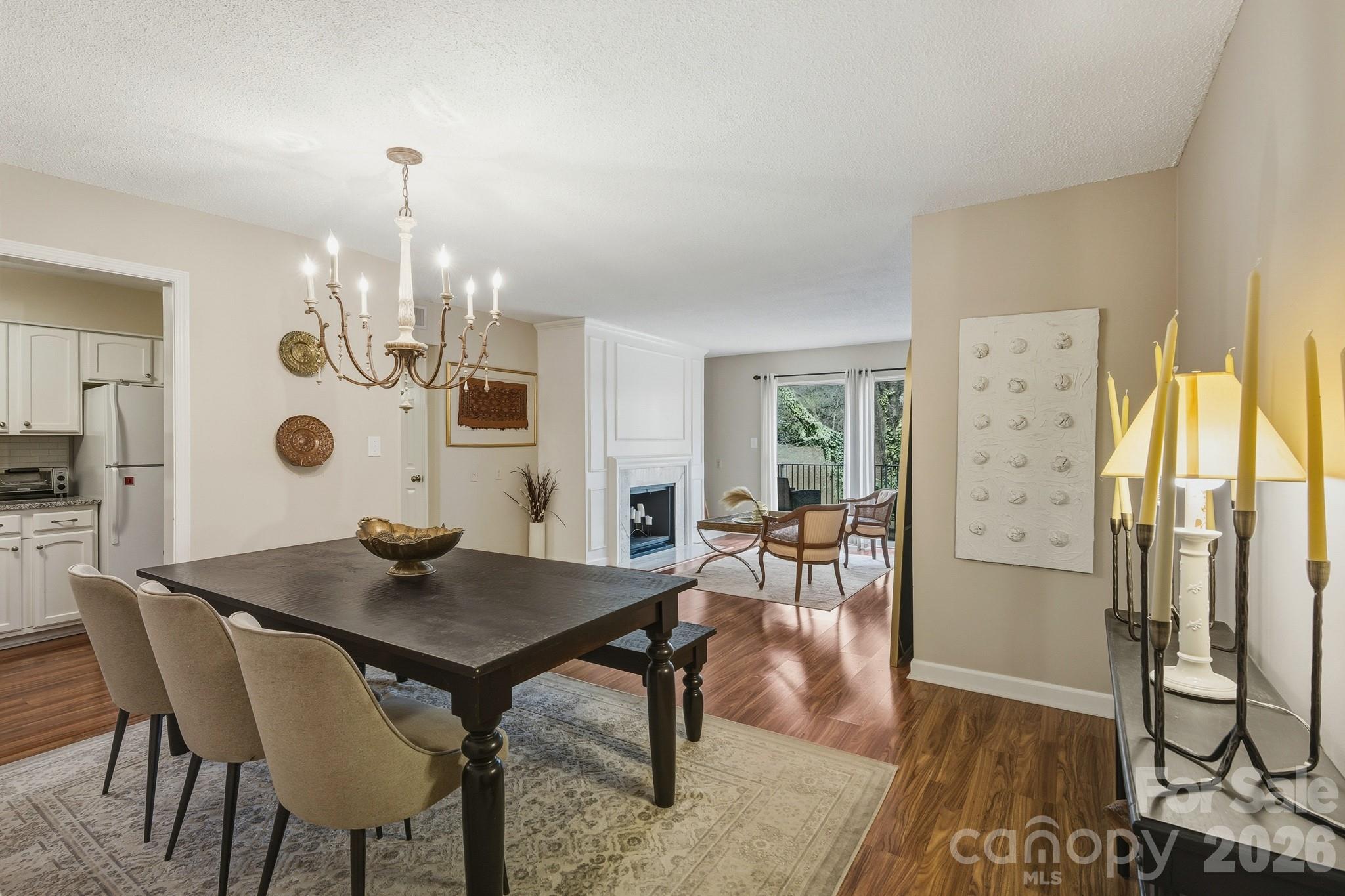 Prime location in the heart of South Charlotte with convenient access to SouthPark, Uptown, the light rail, and the Harris YMCA. This beautifully maintained one-level condo offers an inviting interior with upgraded molding, stylish lighting, hardwood flooring, and granite countertops in both the kitchen and bathrooms. A welcoming fireplace and cozy den with built-in bookcases create a warm, comfortable living space that truly feels like home.

The community offers exceptional amenities, including pickleball and tennis courts, two renovated swimming pools, three fully stocked ponds (fishing allowed), scenic walking trails, and a clubhouse with a pool table. The HOA provides outstanding value, covering heating and cooling, water, sewer, trash, grounds maintenance, carport maintenance, pest control, and building insurance.

Seller incentive available: HOA dues paid through the end of the year or $5,000 toward closing costs with an acceptable offer.

Special Features:

Cozy den with built-in shelving and storage
Functional, usable fireplace
Spacious primary closet with built-in shelving
Kitchen pantry for added storage
Peaceful setting in a highly sought-after neighborhood with mature trees, pools, tennis and pickleball courts, and clubhouse
Walkable to dining, shopping, and nearby greenway
HOA covers all exterior maintenance, repairs, and replacements (excluding windows and private deck)
HOA-maintained boiler heating and cooling system for lower electric bills
Excellent opportunity for rental income or first-time homebuyer
Motivated seller!