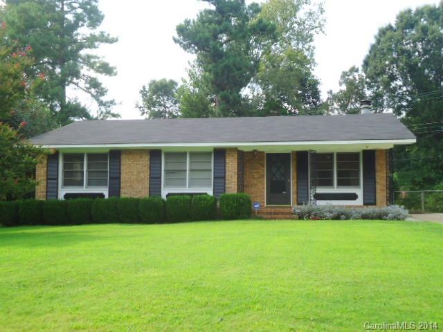 Such a great brick ranch home with lots of updating!  3 large bedrooms, updated baths, spacious kitchen with newer range, great room has a fireplace.   Roof is only 5 years old.  Huge deck, fenced back yard, storage building and front porch!  Cute as can be!  Hardwood floors under carpet (per seller) in the front two bedrooms.