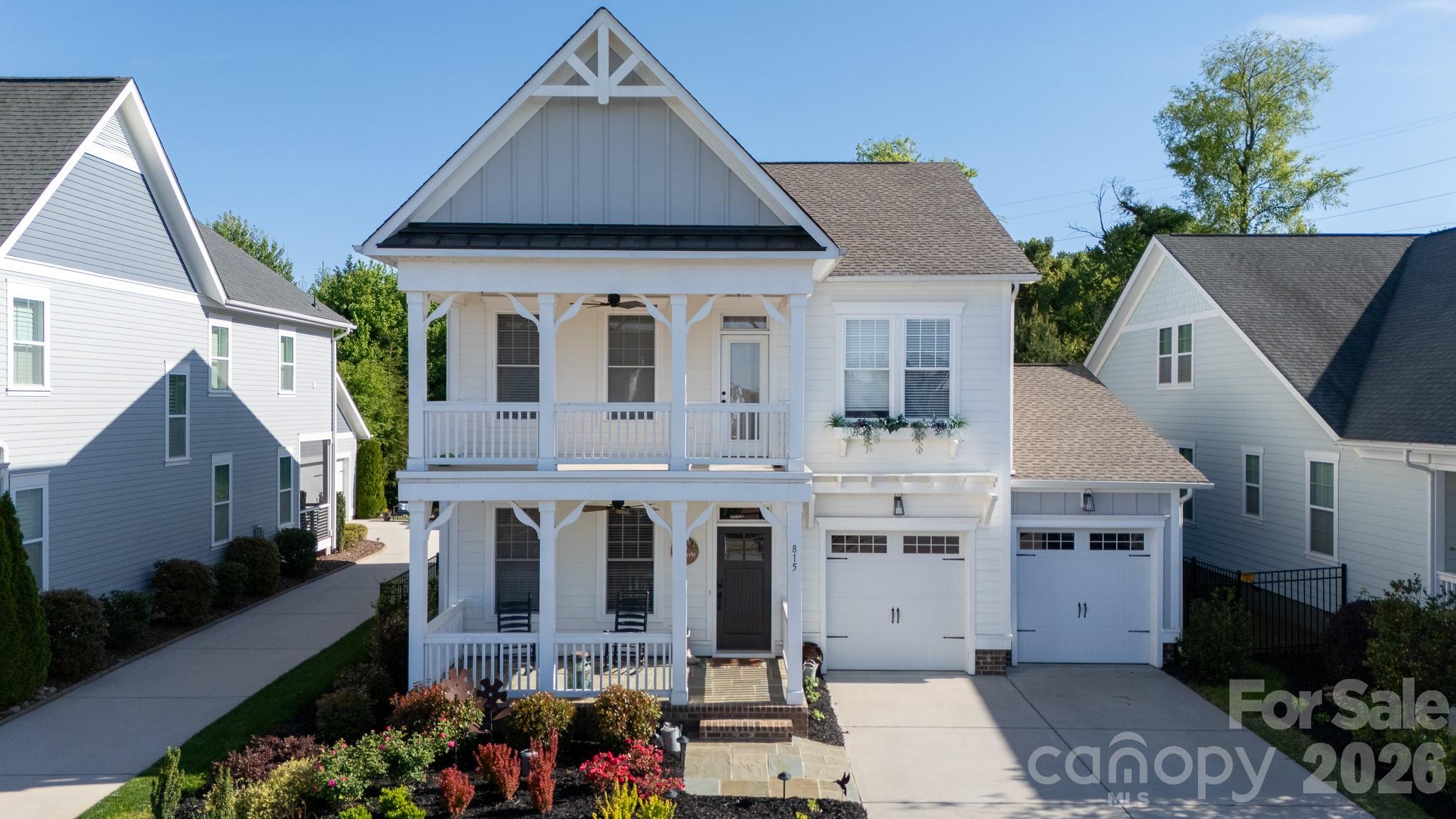 Experience the ultimate active lifestyle in the heart of Riverwalk, Rock Hill’s premier riverfront community. Built in 2022, this 2,615 square foot home offers modern comfort and outdoor adventure. Imagine starting your day enjoying the 3-mile riverfront trail or launching a kayak for a peaceful morning on the water. The home welcomes you with a classic front porch leading into a bright, open floorplan designed for connection. The chef-inspired kitchen features a massive work island, gas range, and a walk-in pantry, overlooking a spacious dining area and a living room centered by a warm fireplace. A rare main-level bedroom and full bath provide ideal accommodations for guests or a home office. Upstairs, the primary suite is a true retreat, boasting a balcony, a cozy sitting area, and a spa-like bathroom with dual sinks and a large tiled shower. Practical features like a dedicated drop zone, a large laundry room with a sink, and a fully fenced backyard ensure every day-to-day need is met. With world-class amenities like the Velodrome and BMX track, plus local favorite restaurants and retail shops within the subdivision, this home offers a lifestyle of convenience and excitement.