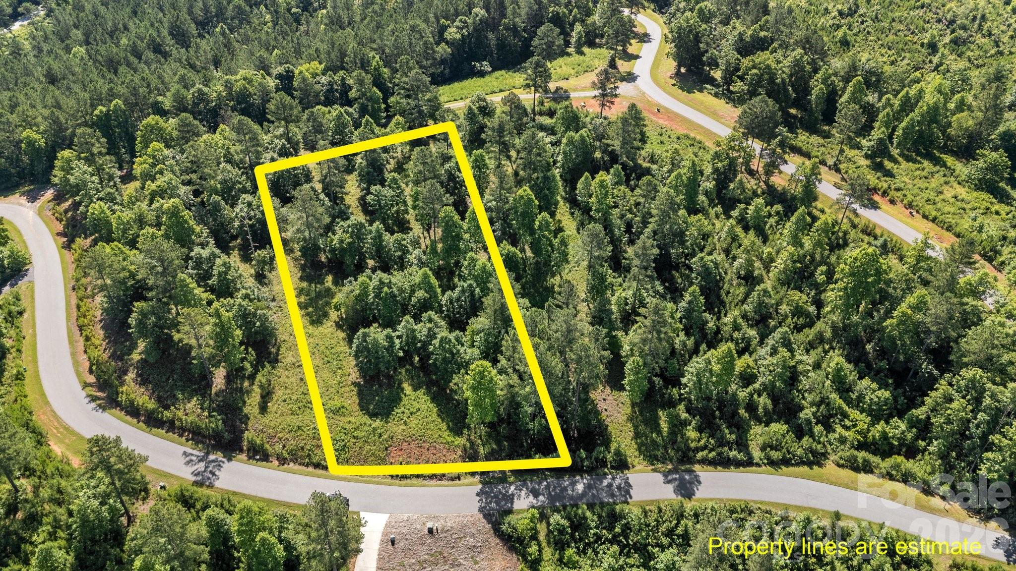 Discover the perfect opportunity to build your dream home or vacation retreat on this exceptional 1.3-acre lot with a 3BR septic and well permit. Nestled in a serene and picturesque setting, this flat and partially cleared property offers a canvas of possibilities. Situated just a second row back from the beautiful Lake Rhodhiss, you'll enjoy the tranquility and natural beauty of lake living without the hustle and bustle of waterfront traffic.  Minutes from Castle Bridge Public Access and Marina you will enjoy easy access to Lake Rhodhiss for all your recreational activities.
Serene and Private so you can enjoy the peace and quiet while being close to the action.
Surround yourself with the lush greenery and stunning landscapes of Lake Rhodhiss.
Don’t miss out on this unique opportunity to secure a prime piece of real estate in one of North Carolina's most desirable locations. Create the life you’ve always dreamed of with this versatile and ideally situated gated community.