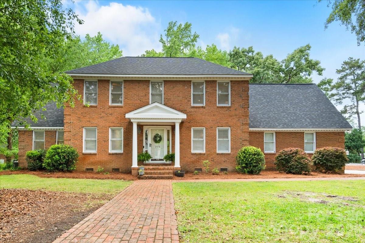 This incredible property spans a vast, corner lot in one of Cheraw’s most desirable neighborhoods. The primary residence offers 5 bedrooms and 3.5 bathrooms, with a flexible bonus room accessible from both the upstairs hallway and the downstairs kitchen area—ideal for a home office or extra living space. The downstairs features a beautifully renovated kitchen that opens to a spacious demand a cozy sun porch, along with a formal dining room, small powder room, and a generous primary suite with an updated bath. Outside, you’ll find a two-car, attached garage and one of the finest multi-level decks around! Constructed from engineered materials, it features an outdoor kitchen and plenty of room to entertain or unwind. A path out back leads to a separate guest/pool house with over 680 square feet and features a small kitchen, full bath, and a spacious living area with a fireplace, opening to a screened porch. The front of this guest house overlooks a uniquely shaped saltwater pool (31 by 43 feet). Its separate driveway and entrance make this part of the property perfectly suited for entertaining, private guest space, or even short-term rental. The pole barn(24x36x14)) provides great, sheltered space. Surrounded by mature trees, this oasis offers exceptional privacy. An additional lot behind the home also conveys, providing even more space and peaceful seclusion. Also important to know, there have been many recent, important updates including: a young roof (2020) and downstairs HVAC (2022), upstairs HVAC (2025), Pool house HVAC (2025), saltwater system for pool (2024). This one, truly, is as good in person as it is on paper! Shown by appointment only.