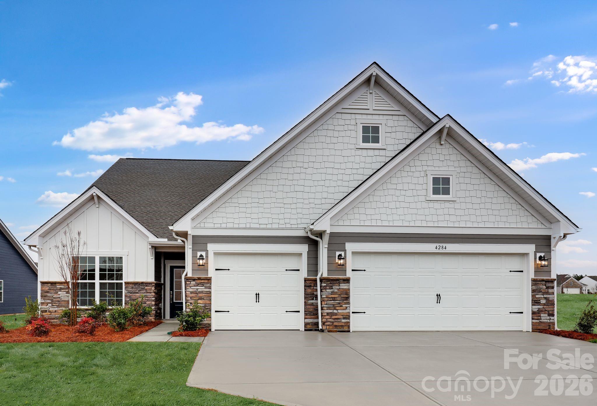 The Garland floorplan is a new single-story home design that combines comfort and elegance. It features a formal living and dining room for entertaining, a family room with a fireplace for casual gatherings, a covered porch, three-car garage and a sunroom for indoor-outdoor living. Two secondary bedrooms and a lavish owner’s suite are made for rest and relaxation. Plus, our signature Everything's Included program means you will get a gourmet kitchen with double ovens and cooktop, quartz or granite kitchen countertops, subway tile backsplash, ceramic tile, luxury vinyl plank flooring throughout the home, and a gas fireplace. Roselyn is a master-planned community offering exclusive ranch homes designed for active adults!