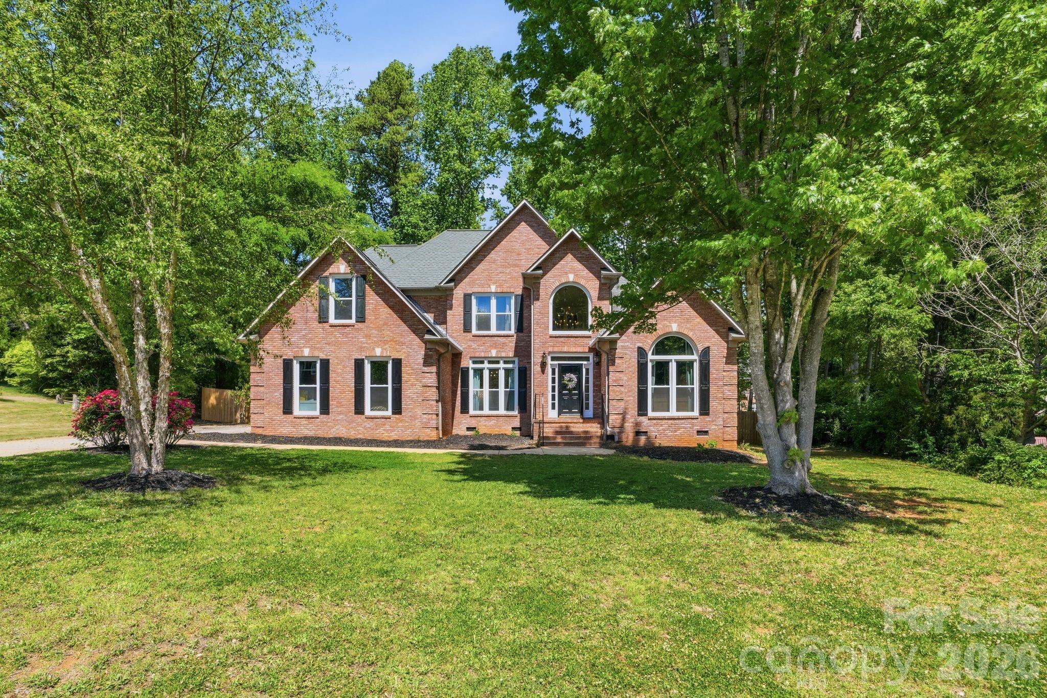 Welcome to this beautifully updated, all-brick home in the highly sought-after Wedgewood community, where timeless charm meets modern upgrades in an unbeatable location close to the hospital, shopping, dining, and everyday conveniences. Step inside to find a thoughtfully remodeled interior featuring a stunning, fully updated kitchen complete with quartzite countertops, custom paneled sub-zero fridge and an open layout that flows seamlessly into the breakfast area and spacious sunroom - perfect for everyday living and entertaining. The home also offers a formal dining room, a two-story living room filled with natural light, a laundry room, and a convenient half bath.The main-level primary suite is a true retreat, offering a generous bedroom with a sitting area and a completely renovated ensuite bathroom featuring a gorgeous soaking tub, separate tiled shower, dual vanities, and a large walk-in closet. Upstairs, you’ll find three additional bedrooms, a full bathroom, and a versatile bonus room ideal for a playroom, media space, or home office. Recent updates include new carpet and windows, giving the home a fresh, move-in-ready feel. Situated on a spacious lot with easy access to the neighborhood park, this home truly checks all the boxes.
