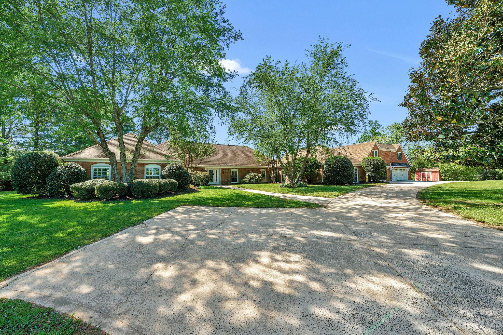 Welcome to this Stunning Weddington Equestrian Estate nestled on 6+ private acres w fenced in pastures, 4 stable horse barn & Award Winning Weddington Schools! Stately full brick ranch boasts a heated salt water pool, pool/guesthouse w sauna, kitchen, bonus room, rec room & 4 car garage. Gorgeous Views, Natural light & Abundance of space throughout main house. Open Concept layout ideal for every day living & entertaining. Inviting entry opens to large executive office & formal DR. Living/Sitting Rm w fireplace, large eat in chefs kitchen w granite countertops, large center island/breakfast bar, range hood & huge walk in pantry w counters. Expansive Great Room w wall of windows, vaulted ceilings & 2nd fireplace. Escape to elegant primary w tray ceilings, ensuite w jetted tub, shower, dual vanities & large walk in closet. 2nd master w full bathroom & walk in closet, 2 additional secondary bdrms, bonus/exercise rm, den & laundry. Incredible Outdoor living w covered patio/ pool/fire pit!