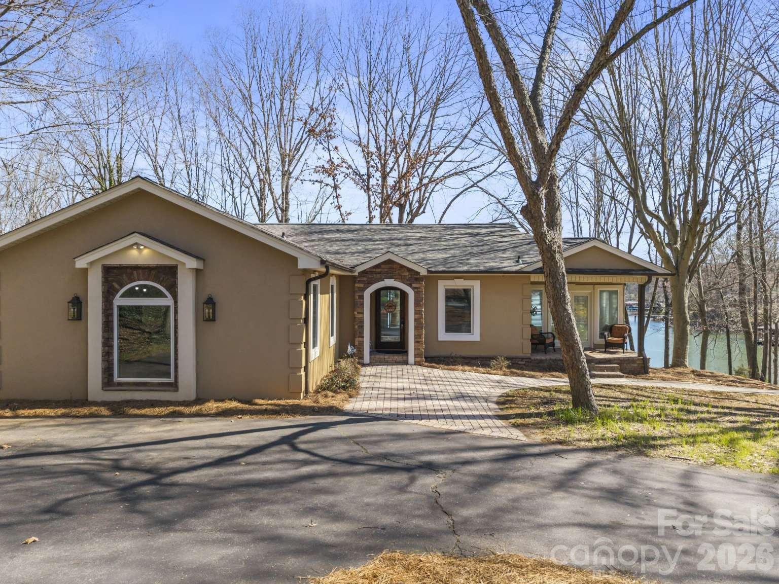 Beautiful waterfront home on Lake Norman in the desirable Sherrills Ford, North Carolina area! Situated on approximately 0.61 acres, this property offers stunning water views, privacy, and direct lake access. The home features 3 bedrooms (2 BR Septic permit) and 3 full bathrooms with a warm, inviting layout designed for comfortable living and entertaining. A spacious family room flows into the kitchen and gathering areas, while large windows fill the home with natural light and capture peaceful lake views. Step outside to enjoy the large deck and covered porch, perfect for relaxing or hosting friends and family. The property also includes a covered deep water boat slip with jet ski parking, making it easy to enjoy boating, fishing, and all that Lake Norman has to offer. Ideal as a full-time residence, weekend retreat, or investment opportunity with convenient access to shopping, dining, and local amenities.