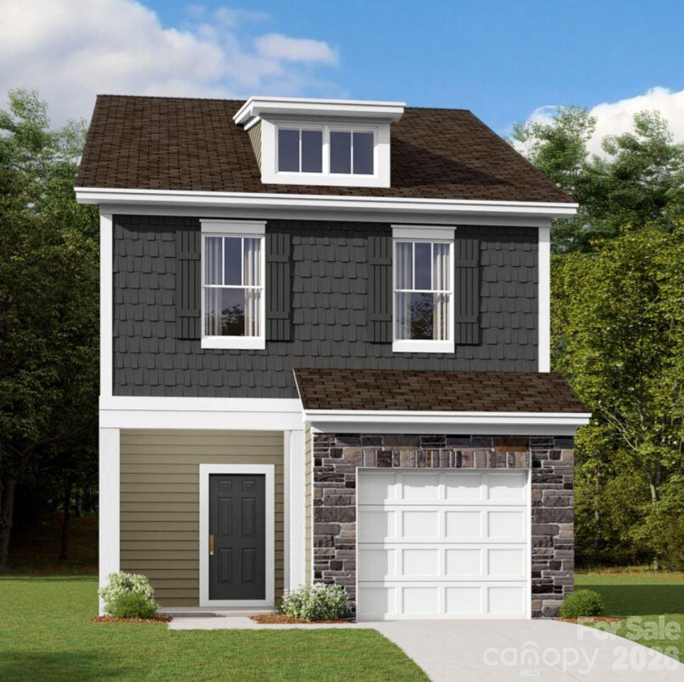 Welcome to the Wylie II at Canterbury Station! This community is located just minutes from Wingate University and offers all the amenities needed for a functional lifestyle. This former model home is sold as-is and does not include furnishings. Walking in from your front porch, you are greeted with a cozy foyer that opens to a spacious open floorplan. The kitchen houses modern stainless steel appliances, a side-by-side door refrigerator, granite countertops & convenient kitchen island for extra prep space. The family room flows seamlessly from the kitchen and has enough space to house a sectional couch, entertainment center & more. Finishing this level, you have a cozy private back patio for those morning coffees. Throughout the main level is easily maintainable EVP flooring for easy cleanup and window treatments have been accented throughout the home. Upstairs you are greeted with your laundry room, complete with a washer and dryer, two secondary bedrooms and a secondary bathroom. The owners suite is fit for royalty, with LED lights, tray ceiling and expanded walk-in closet. The en-suite is straight from a spa, featuring a tiled shower and dual vanity to maximize space and comfort while getting ready in the mornings. Welcome to your new home!