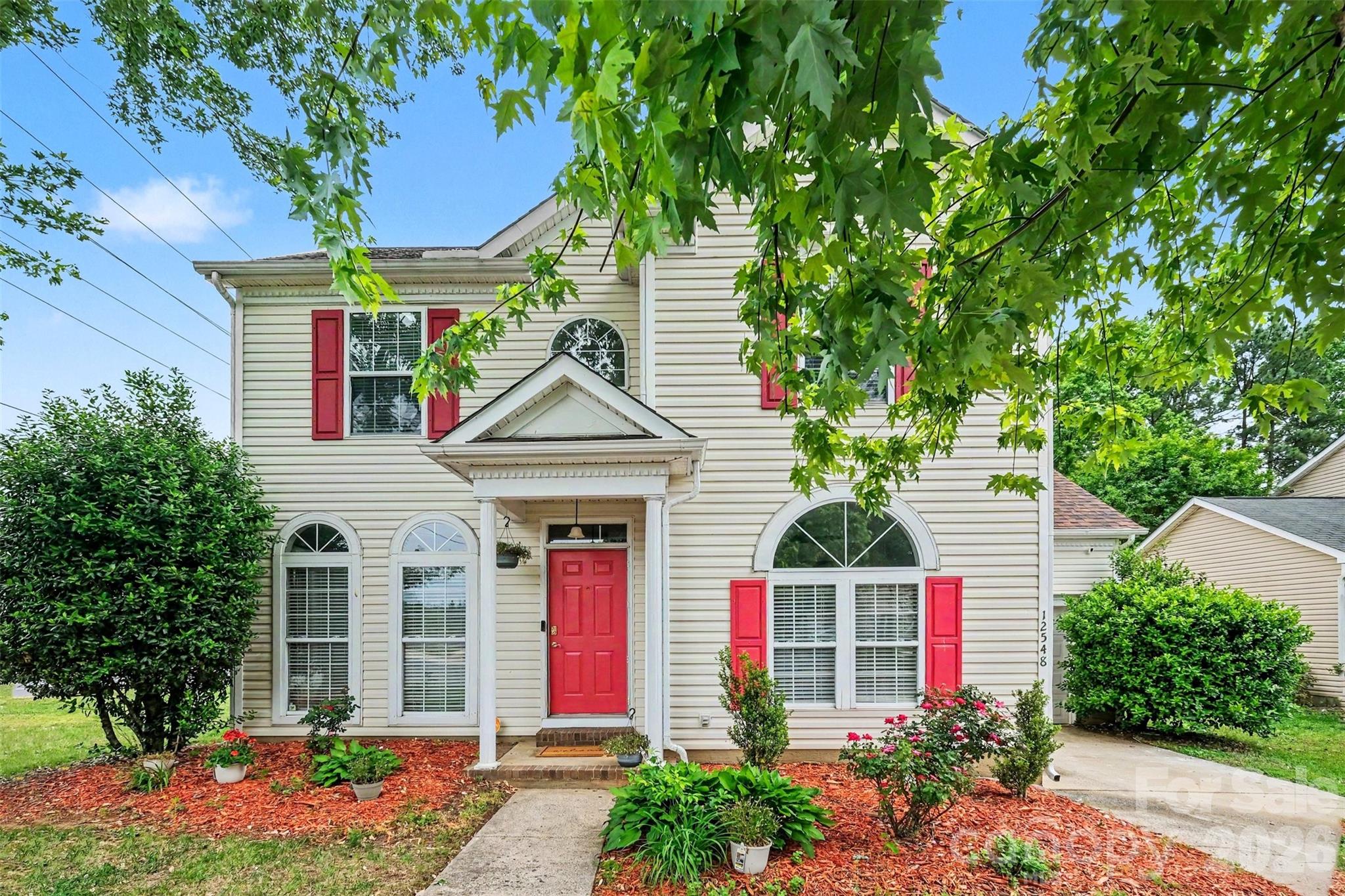 Great corner lot central to Prosperity Village, UNC, Uptown, Concord and more! Refreshed and ready for new owners, this 3 bedroom 2.5 bath home has all the great updates you want, the space you need and more! With aprx 3 yr old windows, roof and siding; all new lighting, switches, outlets, flooring, and paint throughout, this home is ready to go! Your primary bedroom is on the main level with new LVP floors and a stunning ensuite bathroom with walk-in tile shower. Two large secondary bedrooms and a loft upstairs with new carpet and another completely remodeled full bathroom. Fenced back yard with mature, low-maintenance landscaping on a large corner lot, alarm system with cameras, this home is truly move-in ready. Easy access to 485, shopping, dining, University Research Park, UNC, makes the location just as great as the house! Enjoy the character of this home, with all the new updates and low maintenance living for years to come!
